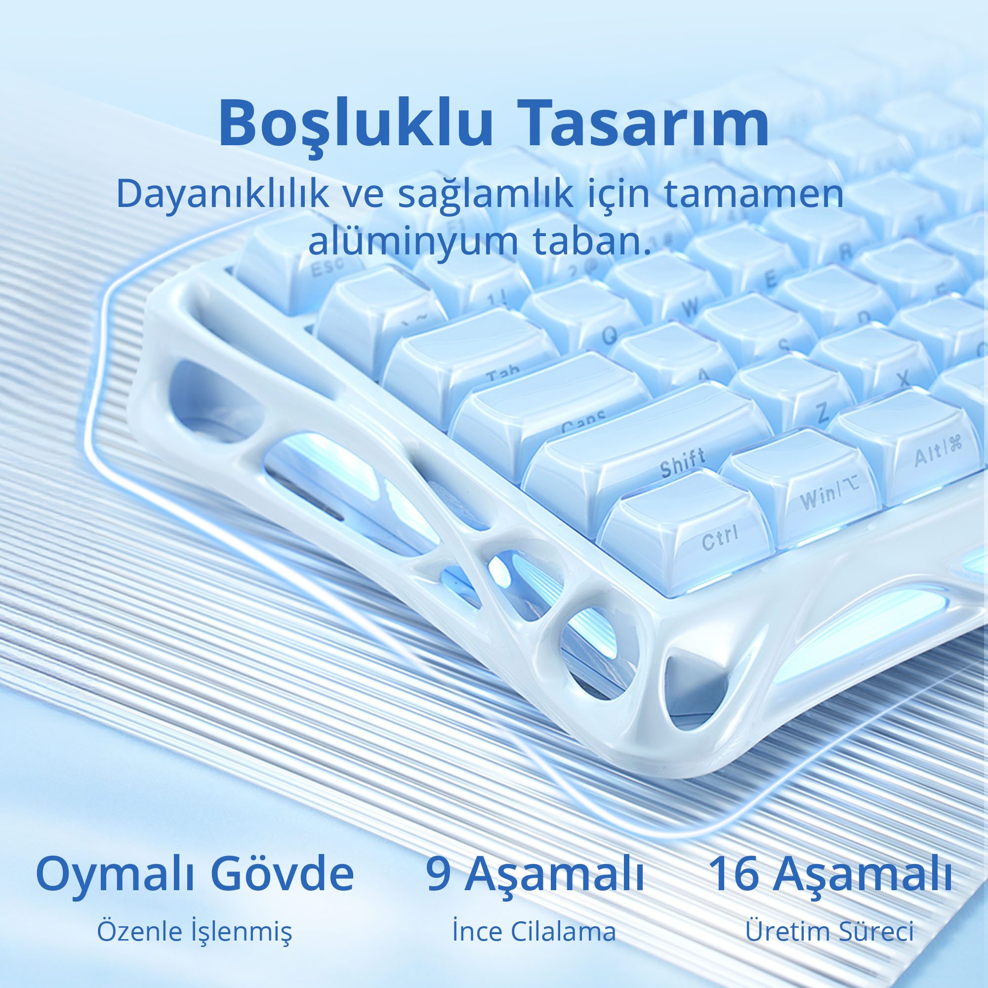 Biało-niebieska klawiatura z podświetlanymi klawiszami. Design podkreśla aluminiową podstawę.