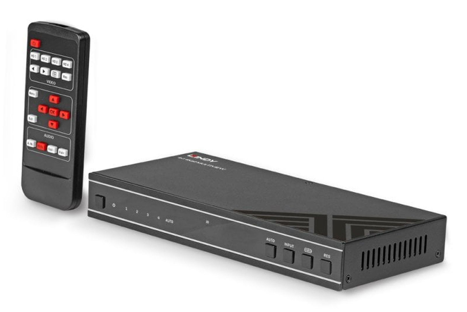 Switch audio/video nero con telecomando. Il telecomando è nero con pulsanti bianchi e dettagli rossi. Lo switch ha pulsanti e indicatori.