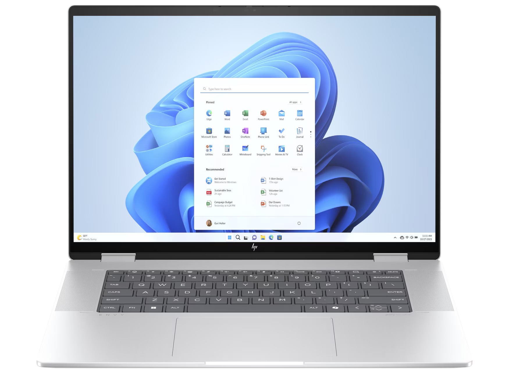 Ein Laptop zeigt das Windows 11 Startmenü. Die Tastatur ist sichtbar, der Bildschirm zeigt App-Symbole und einen blauen Hintergrund.