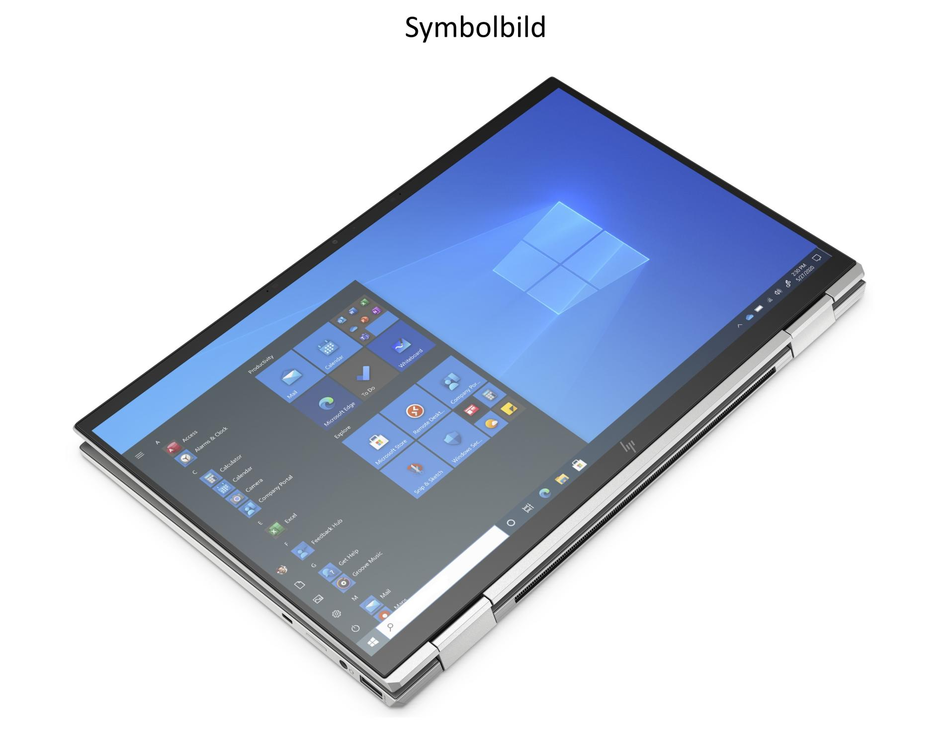 Ein Laptop mit Windows-Oberfläche ist geöffnet. Der Bildschirm zeigt App-Symbole. Der Laptop befindet sich auf einer weißen Oberfläche.