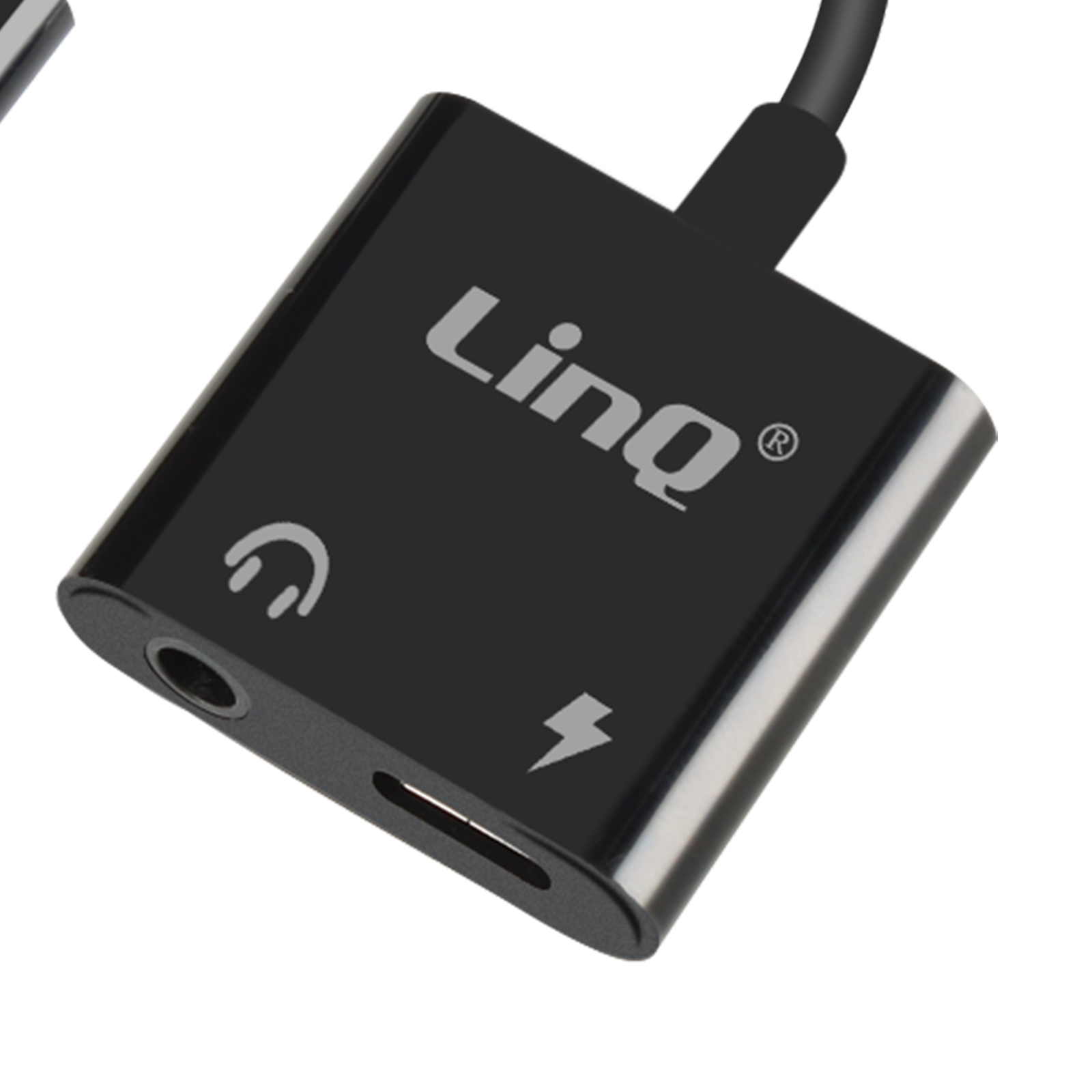 Adattatore audio nero con logo "Linq". Presenta jack per cuffie, porta di ricarica e simbolo fulmine.