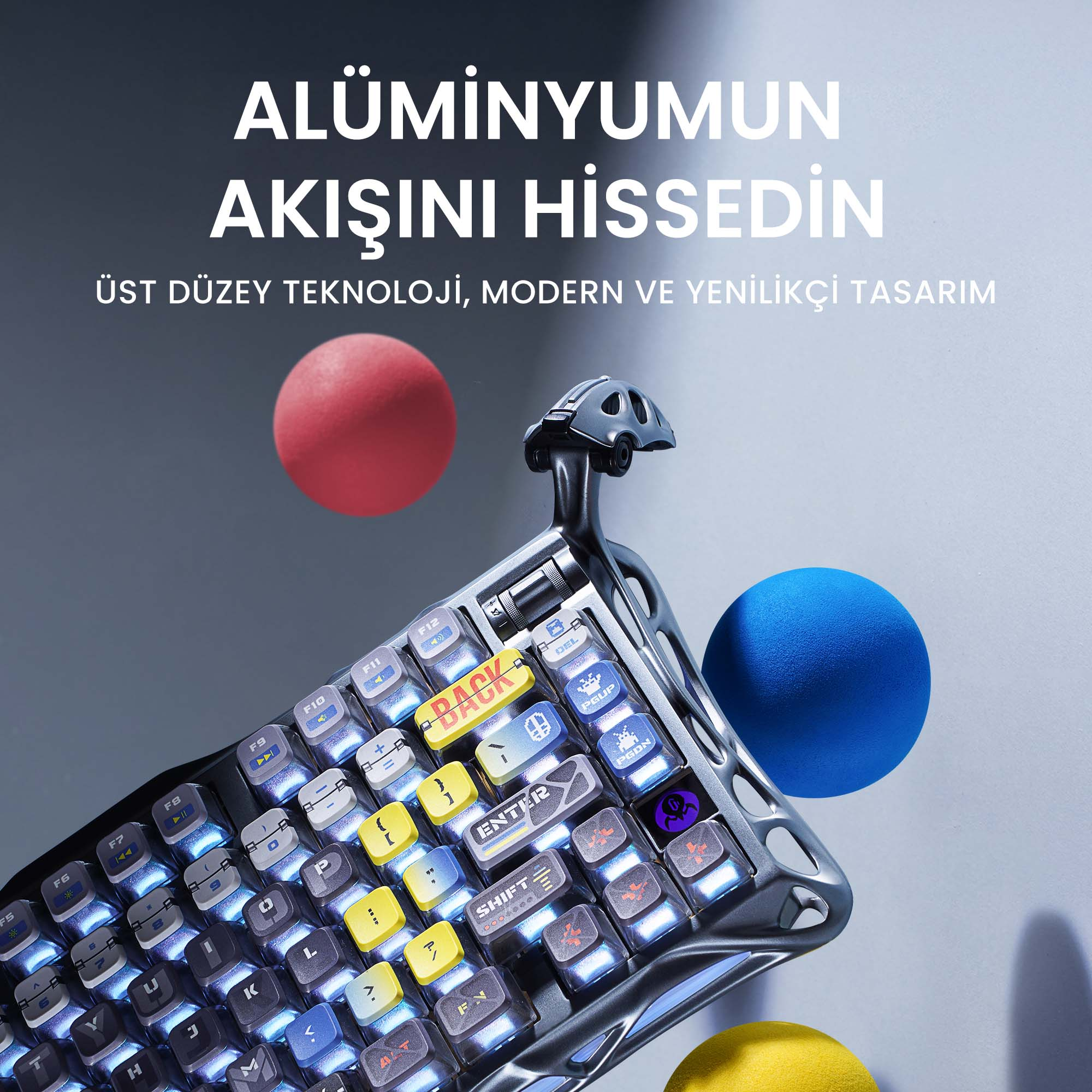 Nowoczesna klawiatura z podświetlanymi klawiszami i unikalnym designem, z czerwonymi, niebieskimi i żółtymi kulami.