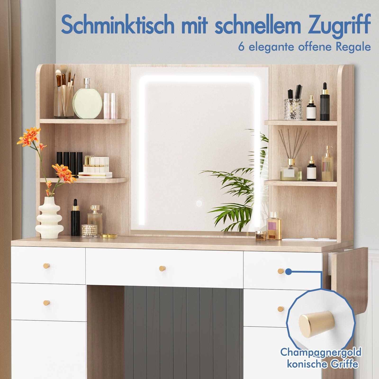 Schminktisch mit Spiegel, Regalen und Schubladen. Auf den Regalen befinden sich Make-up und Parfüm. Goldene Griffe an den Schubladen.