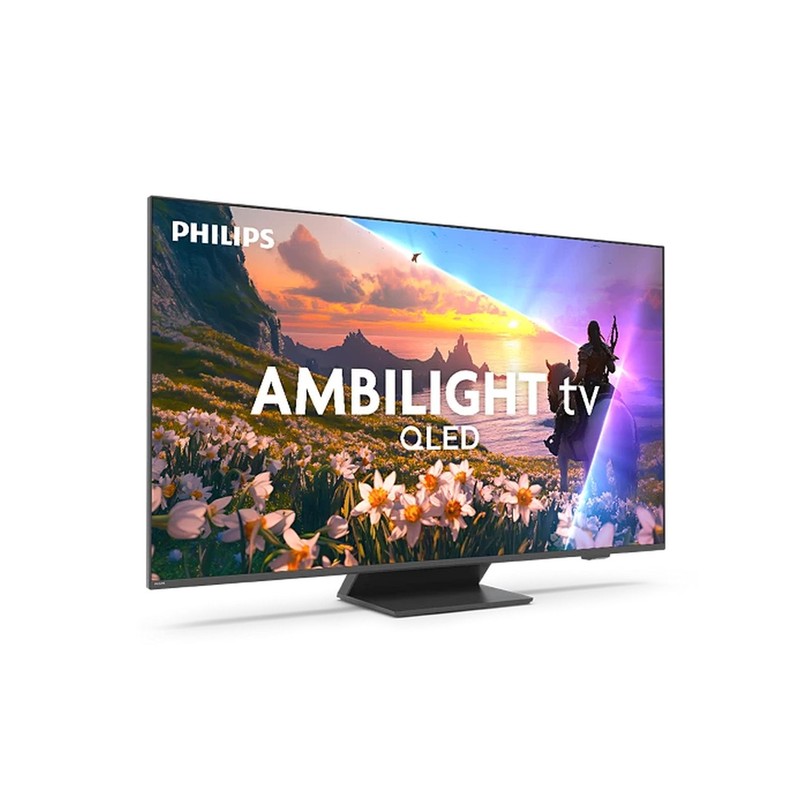 Telewizor Philips Ambilight QLED wyświetla scenę natury. Telewizor stoi na czarnym stojaku. Ekran pokazuje jeźdźca.
