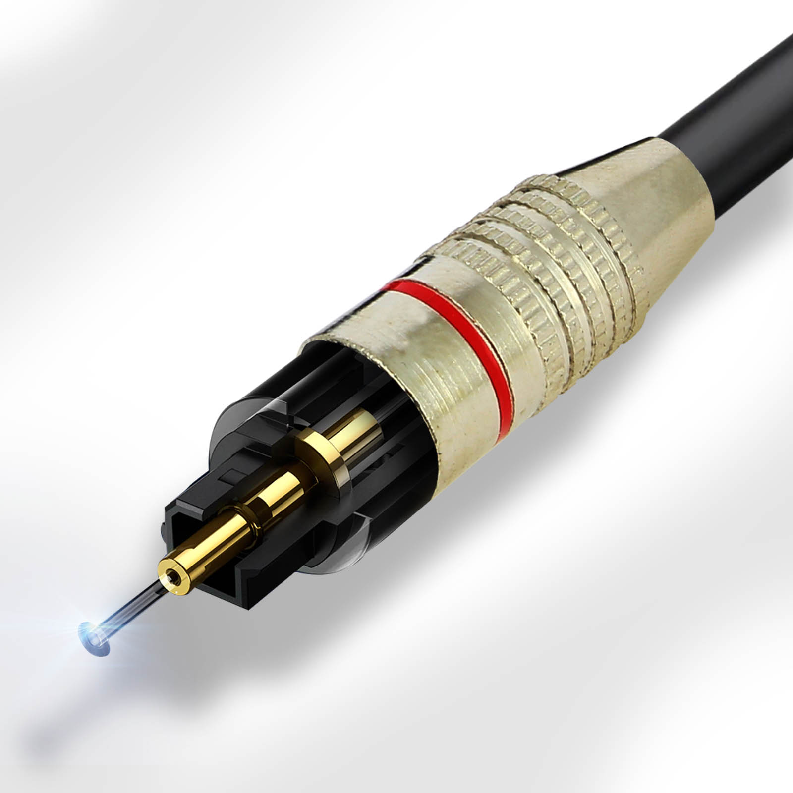 Nahaufnahme eines Glasfaser-Kabelanschlusses. Er hat eine goldene Spitze, ein schwarzes Gehäuse und einen Metallkragen mit rotem Band.