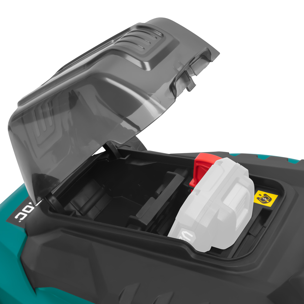 Open compartiment van een groen-zwarte machine. Binnenin zijn een rood en een wit object zichtbaar. Het deksel is grijs en open.
