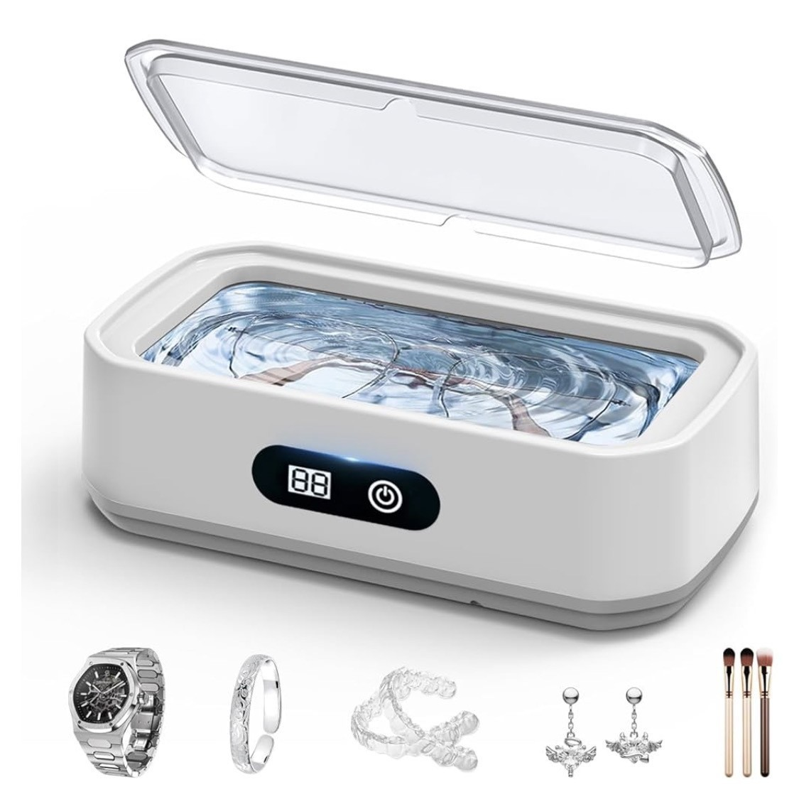 Ein weißer Ultraschallreiniger mit Zubehör. Enthält Uhr, Ring, Zahnspange, Ohrringe und Make-up-Pinsel.