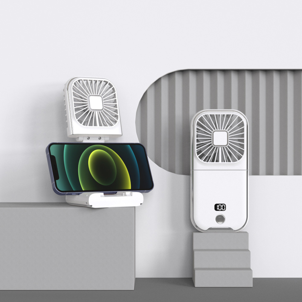 Das Bild zeigt zwei weiße Ventilatoren, einer mit einem Telefon. Der Telefonbildschirm zeigt einen grünen und gelben Farbverlauf. Die Ventilatoren sind auf grauem Hintergrund.