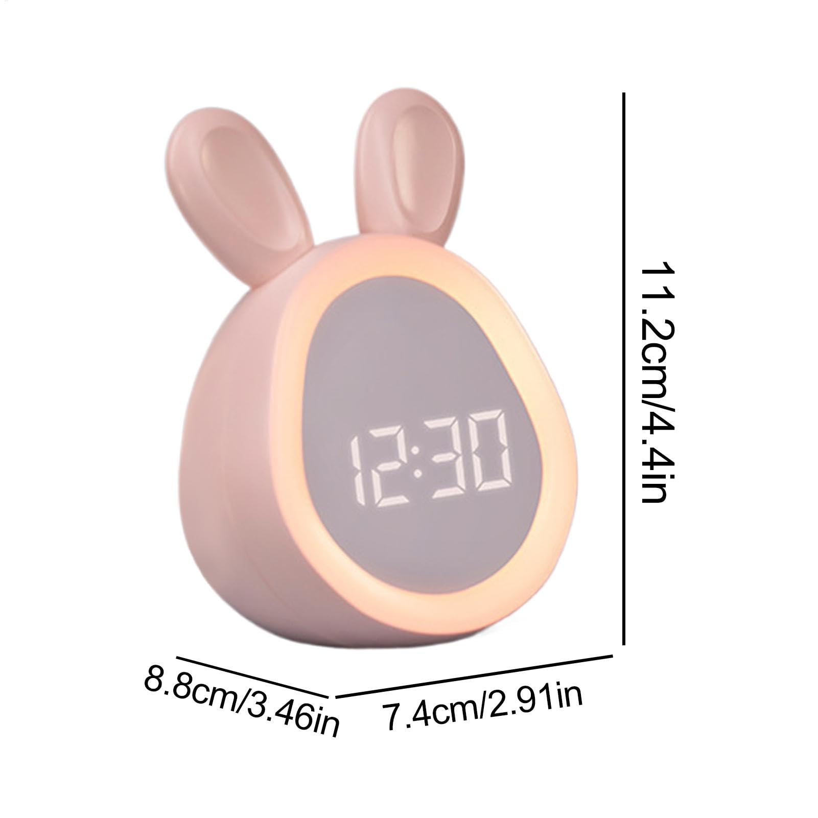 Ein rosa, hasenförmiger Wecker zeigt 12:30 Uhr an. Abmessungen: 11,2 cm, 8,8 cm und 7,4 cm.