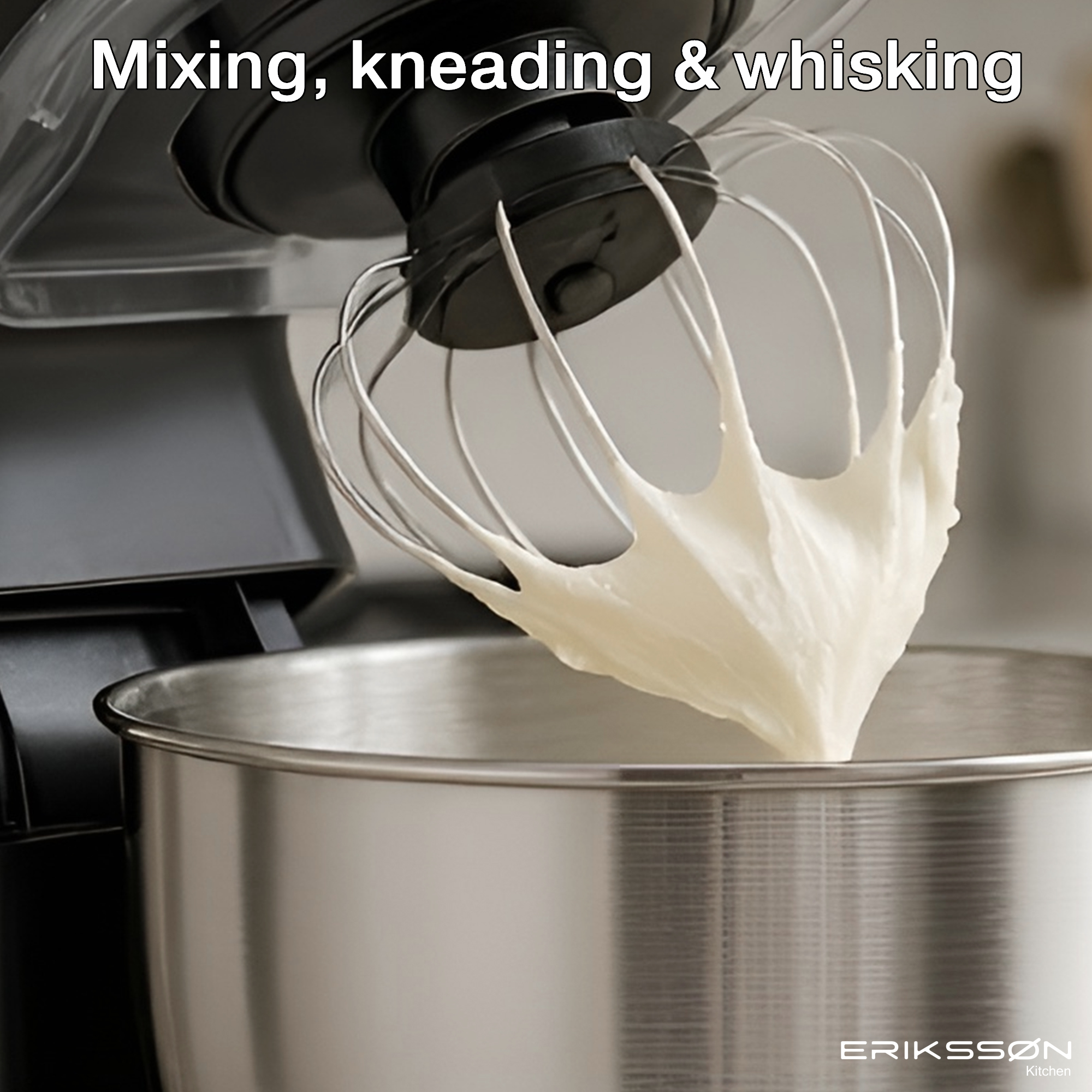 A mixer whisking white cream in a stainless steel bowl. The mixer is black, and the bowl is silver.