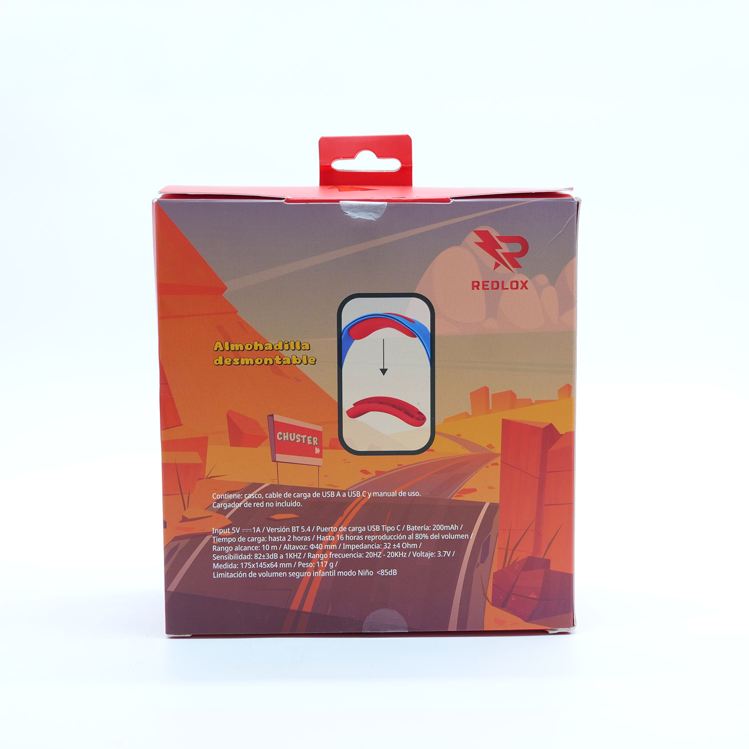 Una caja Redlox con un lazo rojo. Tiene un paisaje desértico e información del producto. La caja está sobre una superficie blanca.