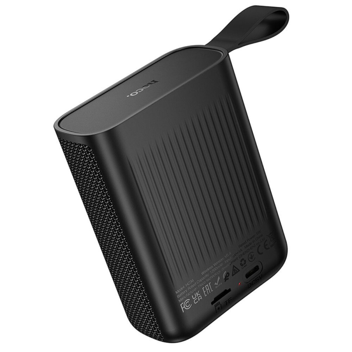 Altoparlante portatile nero con cinturino. L'altoparlante ha una superficie strutturata con linee verticali e un lato in rete.