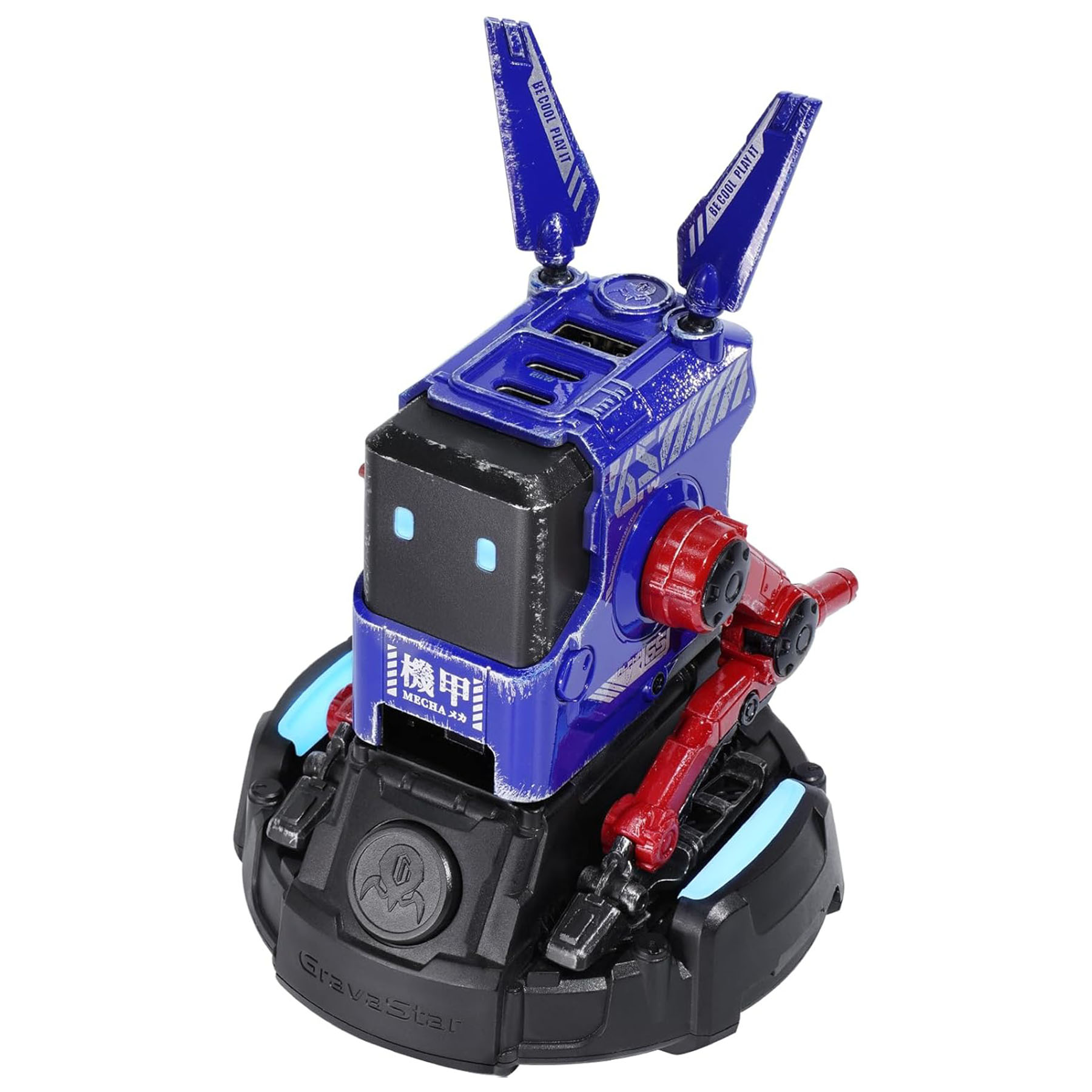 Mavi ve kırmızı bir robot oyuncağı. Köşeli bir kafası, iki anteni ve mafsallı kolları var. Tabanı siyahtır.