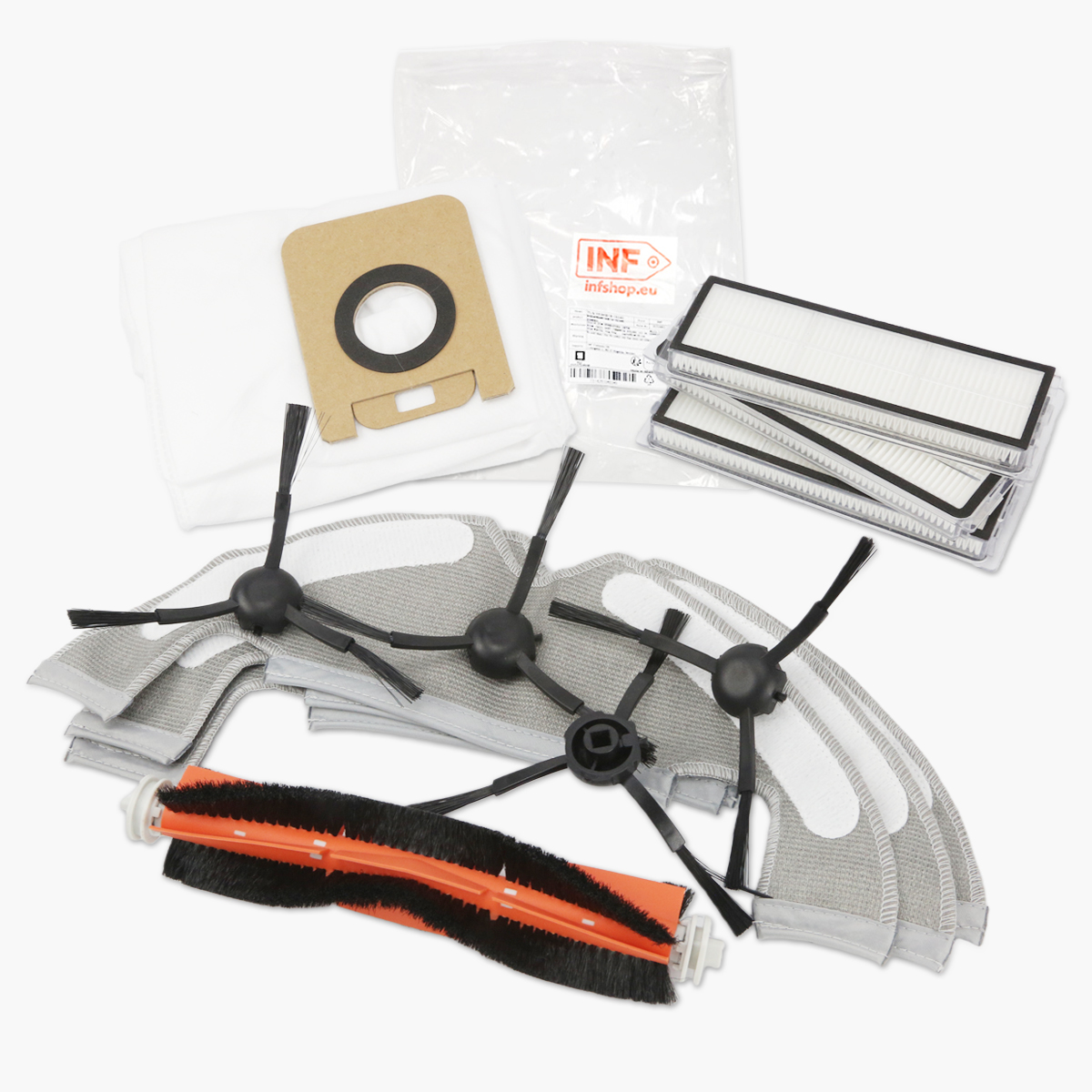 Części zamienne do robota odkurzającego: szczotki, filtry, ściereczki do czyszczenia, worki na kurz i szczotka główna, na białym tle.