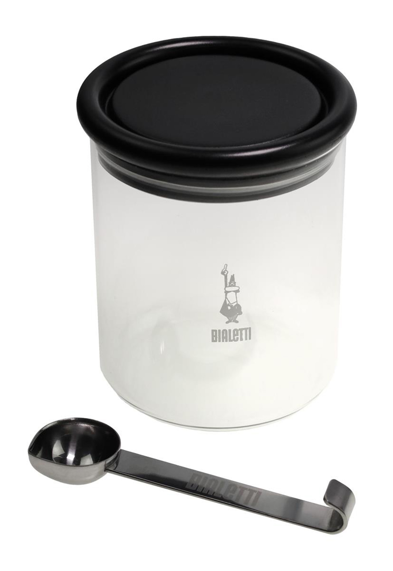 Un barattolo trasparente con coperchio nero e un cucchiaio di metallo. Il barattolo ha un logo Bialetti. Il cucchiaio è curvo alla fine.