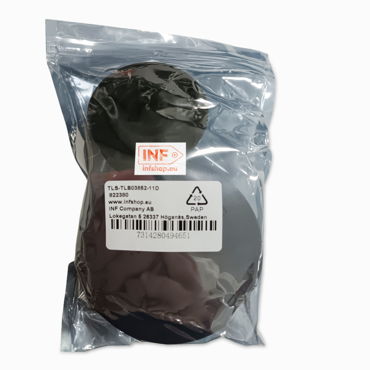 Schwarze kreisförmige Objekte in einer durchsichtigen Plastiktüte mit einem Etikett mit Produktinformationen und einem Barcode.