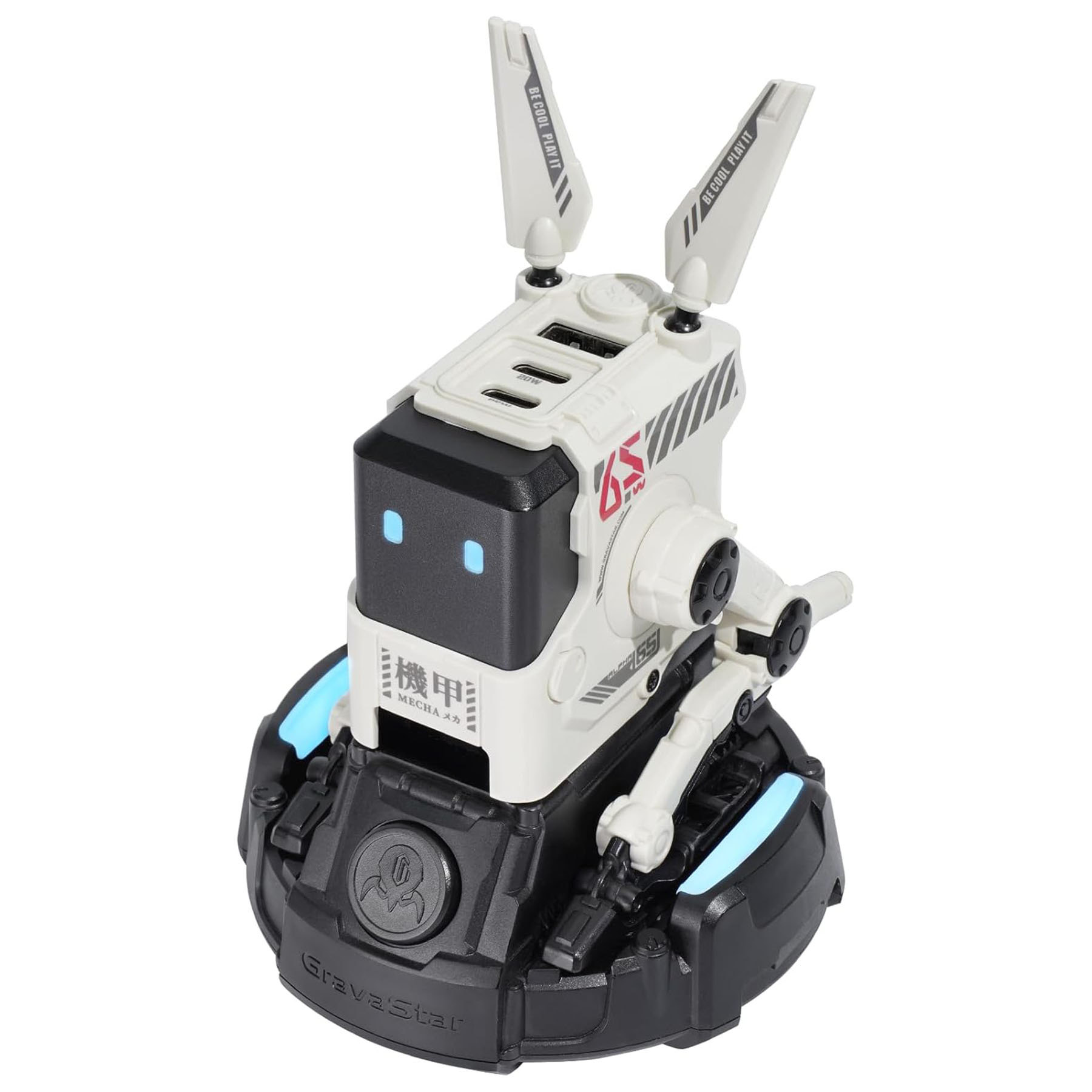 Antenleri, mavi ışıkları ve Japonca metni olan beyaz ve siyah bir robot oyuncak. Dairesel bir tabana sahip.