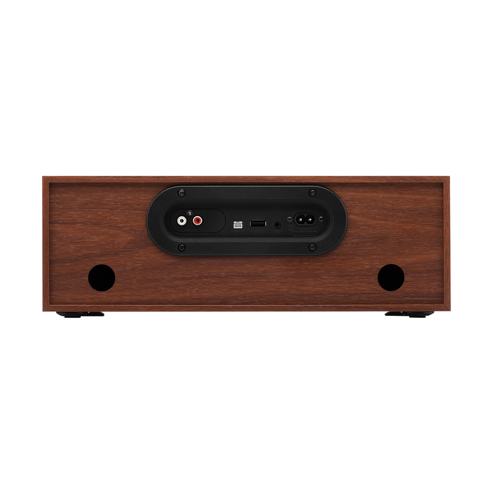 Widok z tyłu drewnianego systemu stereo. Posiada czarny panel z różnymi portami, w tym wejściami audio, USB i zasilaniem.