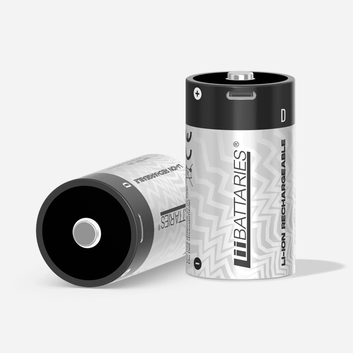 Dwa cylindryczne akumulatory litowo-jonowe, jeden leżący. Są srebrno-czarne z marką LiBattaries.
