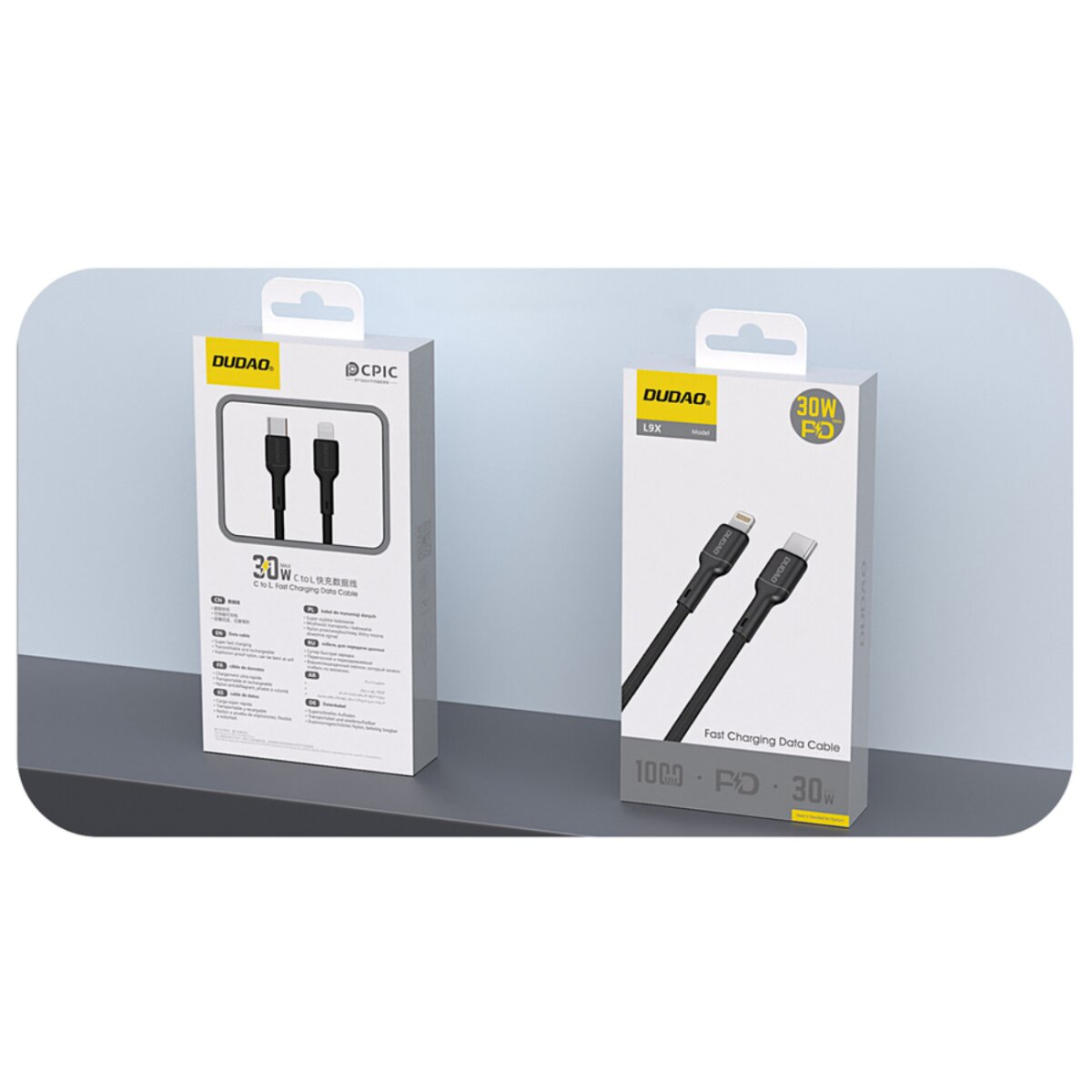 Zwei Schachteln mit Ladekabeln. Eine Schachtel hat ein C-zu-L-Kabel und die andere ein L9X-Modell. Die Marke ist Dudao.