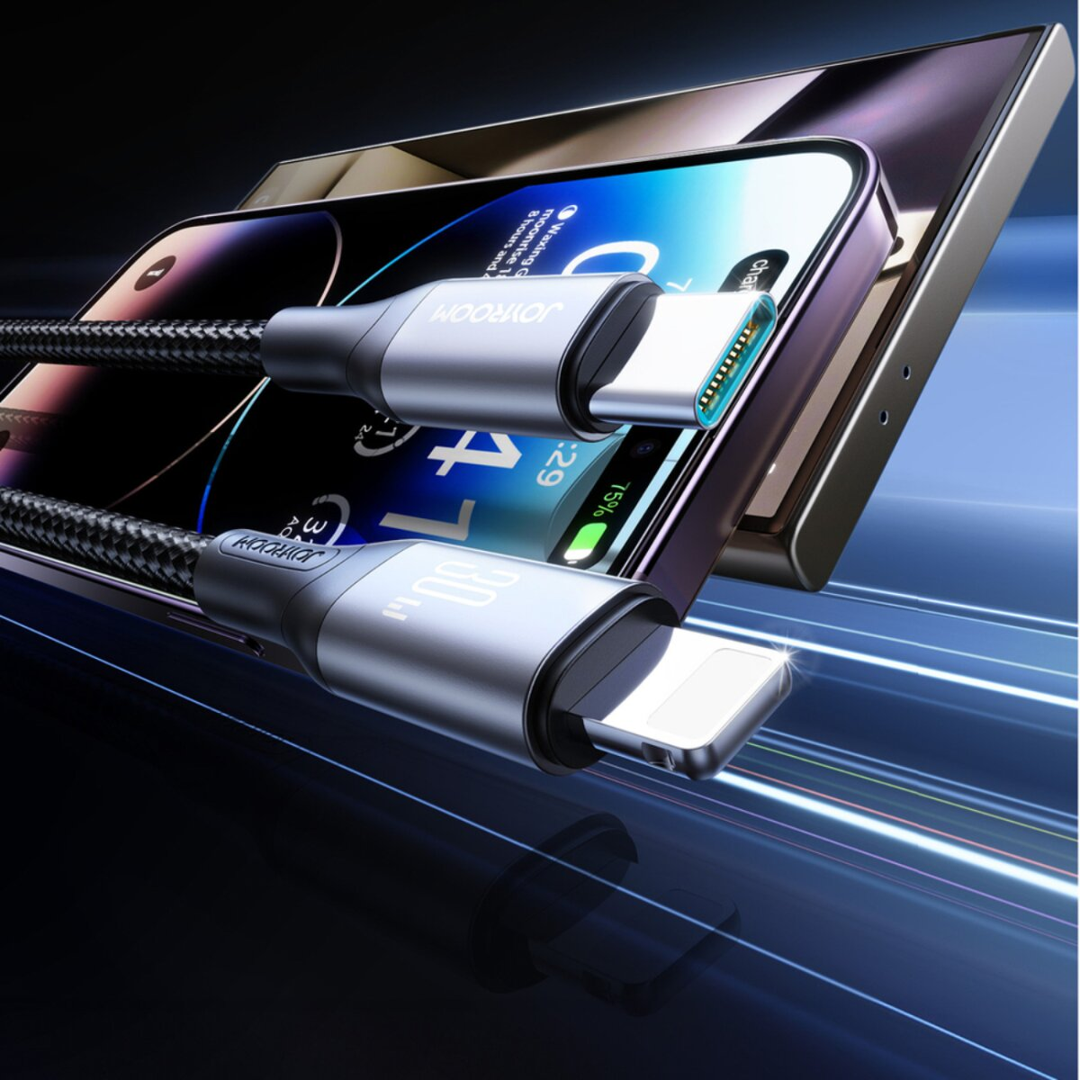 Un téléphone se charge avec un câble USB. Le câble a une texture tressée et des connecteurs argentés. L'écran du téléphone est visible.