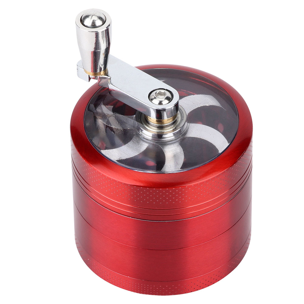 Ein roter Grinder mit silbernem Griff auf weißem Hintergrund. Es hat eine transparente Oberseite.