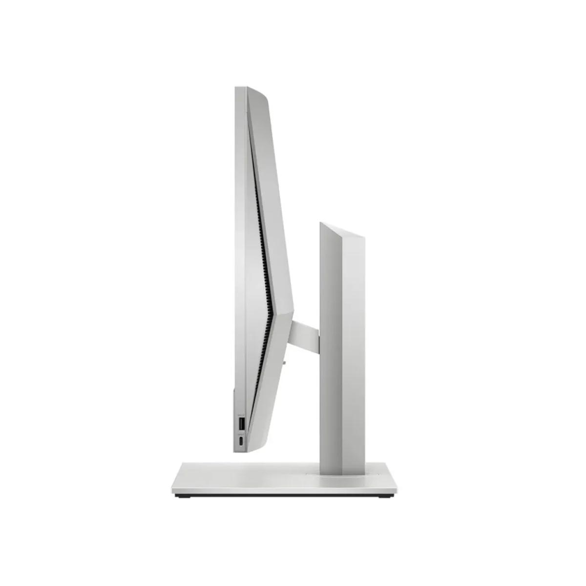 Widok z boku srebrnego monitora komputerowego. Ma cienką ramkę i podstawkę. Tło jest białe.