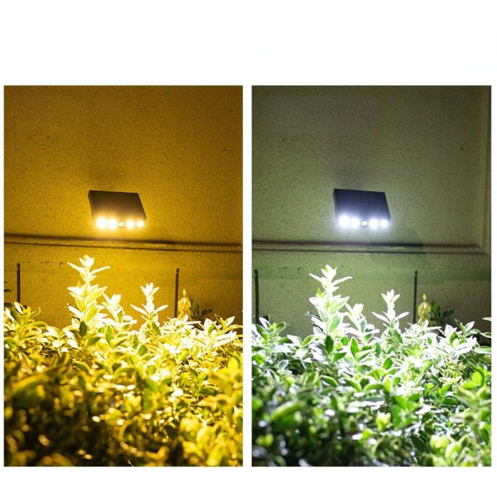 Das Bild zeigt zwei Solarleuchten über üppigen grünen Büschen. Die linke Seite ist ein warmes gelbes Licht, die rechte ist kühlweiß.