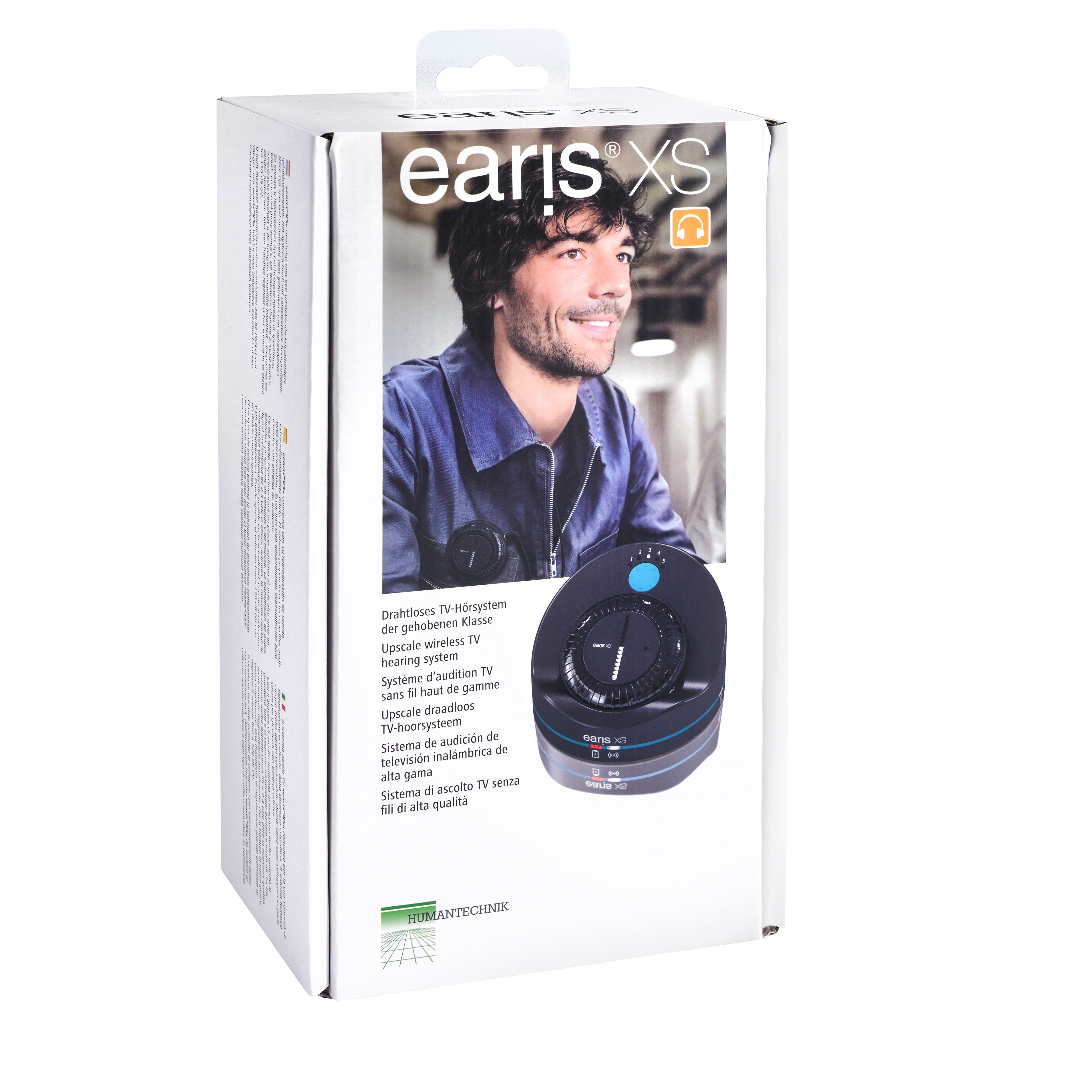 Schachtel mit dem Gesicht eines Mannes und Produktinformationen. Ein schwarzes Gerät mit Knöpfen und Logo.