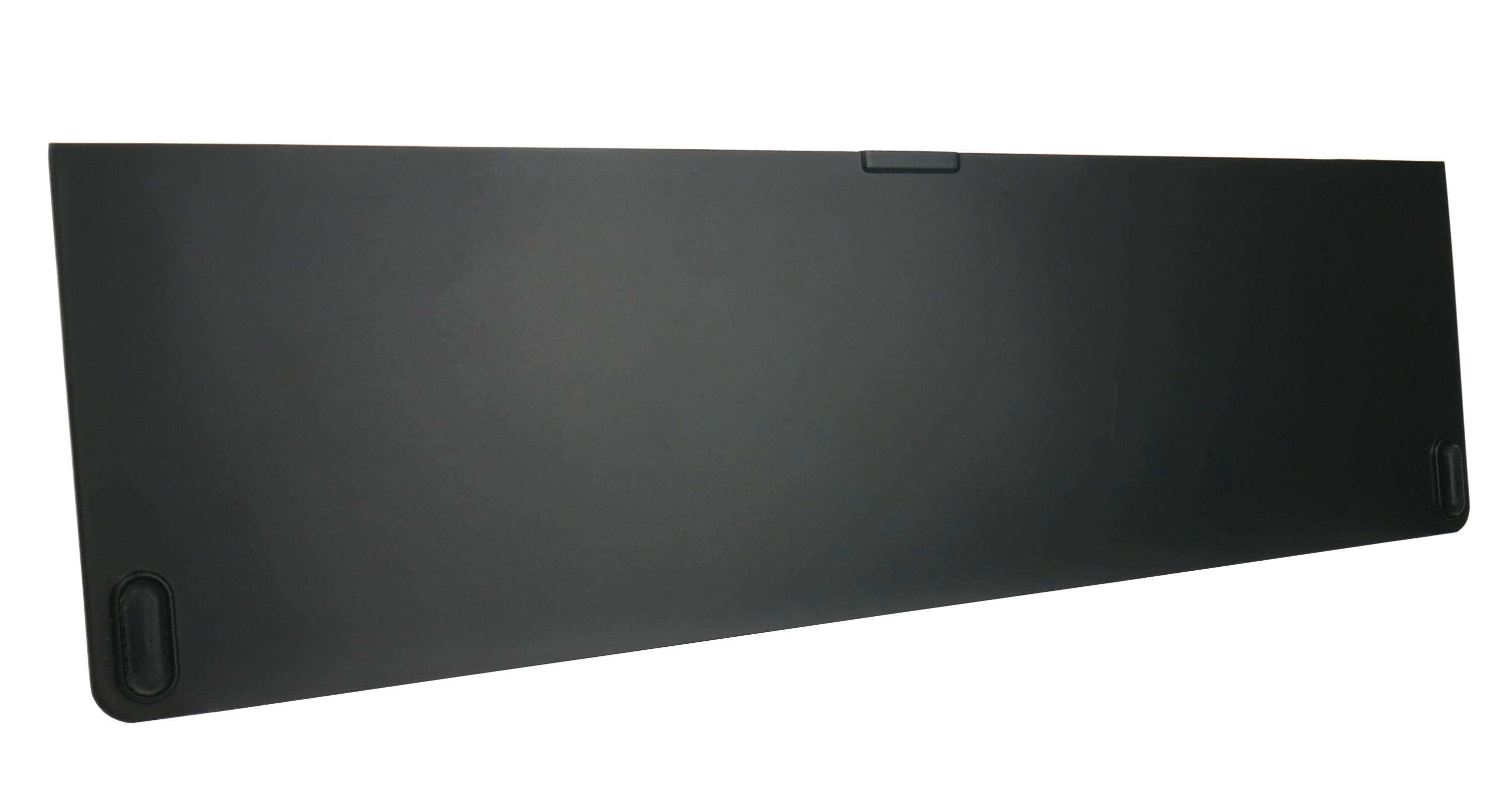 Czarny, prostokątny obiekt z zaokrąglonymi rogami i uchwytem. Widoczne dwa owalne nóżki.