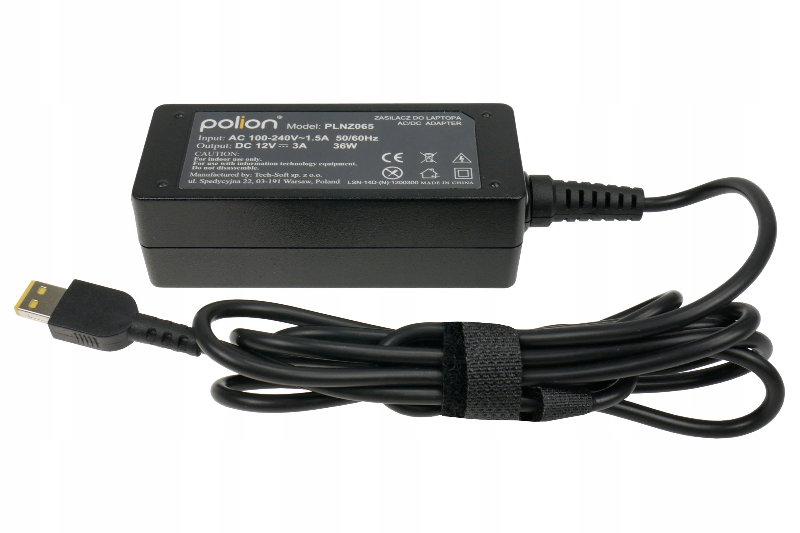 Czarny zasilacz do laptopa z dołączonym kablem i złączem, etykietą z tekstem i rzepem.