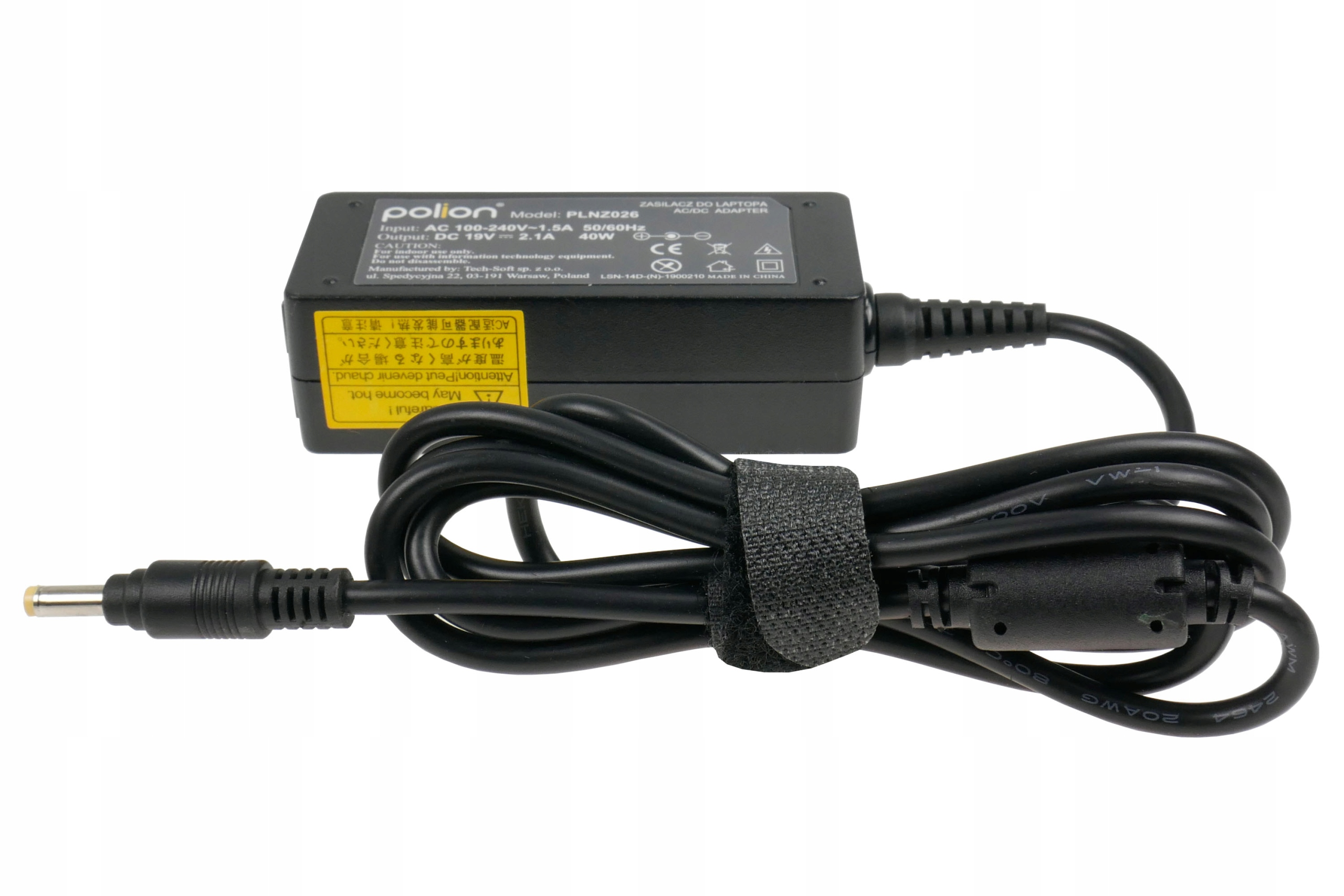 Czarna ładowarka do laptopa z dołączonym kablem, owinięta rzepem. Ładowarka ma żółtą etykietę.