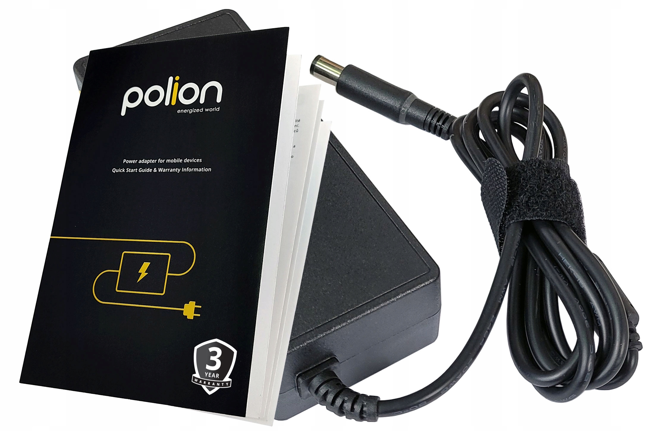 Czarny zasilacz i przewód. Z lewej strony instrukcja. Przewód jest połączony z czarnym paskiem na rzep.