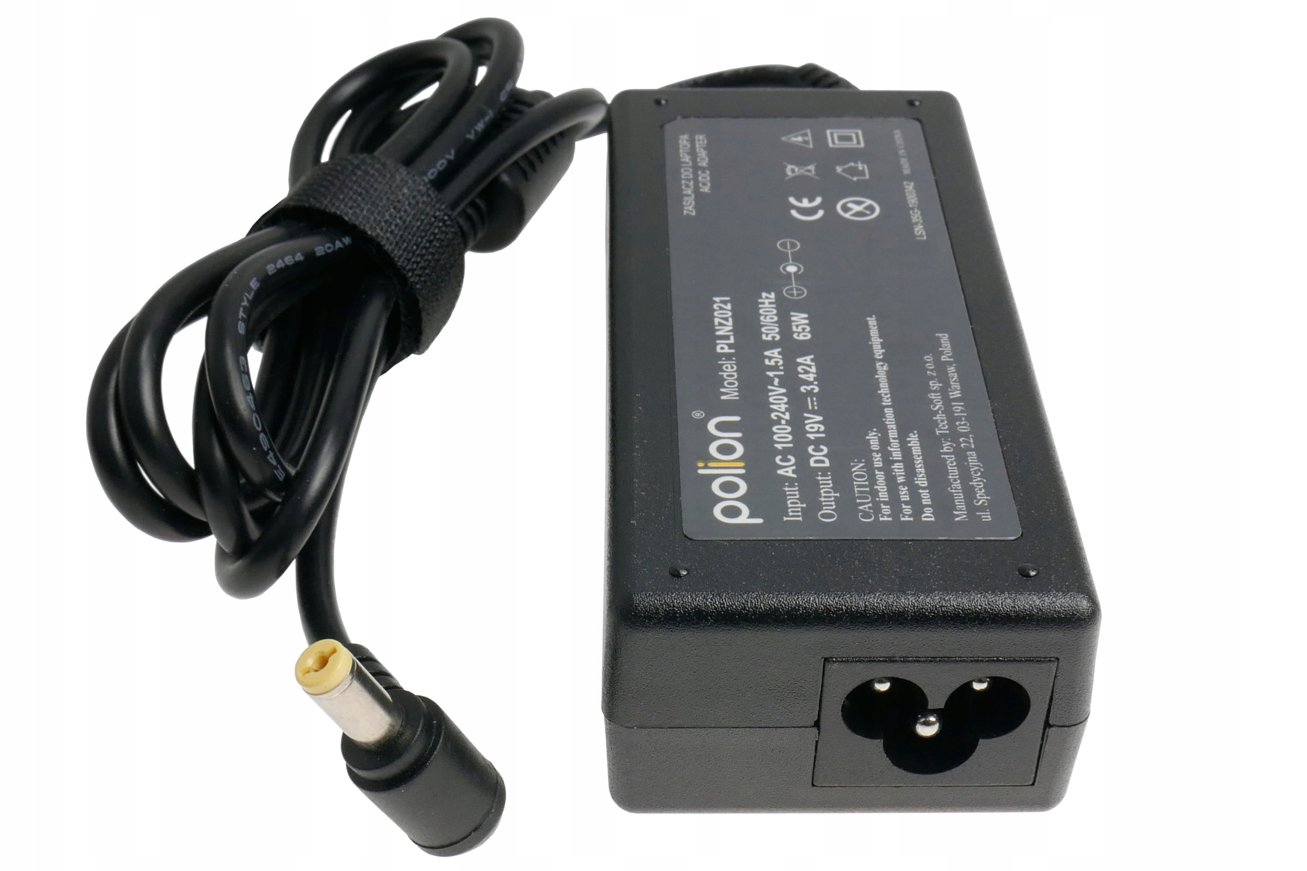 Czarny zasilacz do laptopa z czarnym kablem i żółtą końcówką. Zasilacz ma tekst.