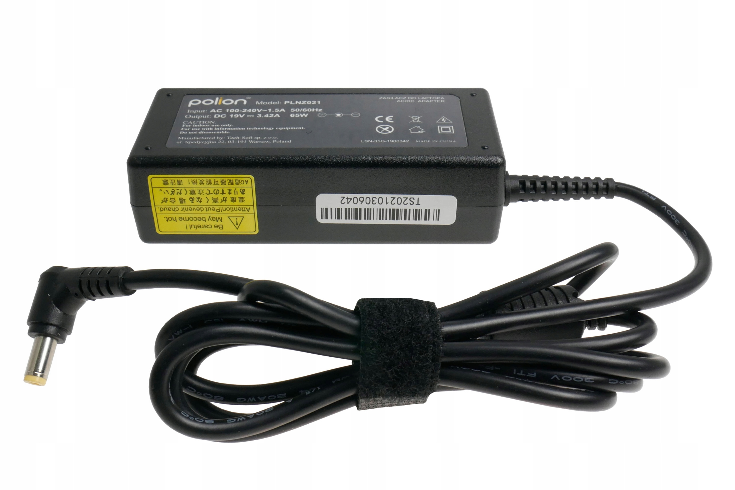 Czarna ładowarka do laptopa z czarnym kablem. Ładowarka ma biały tekst. Kabel jest zapętlony i zabezpieczony czarnym rzepem.