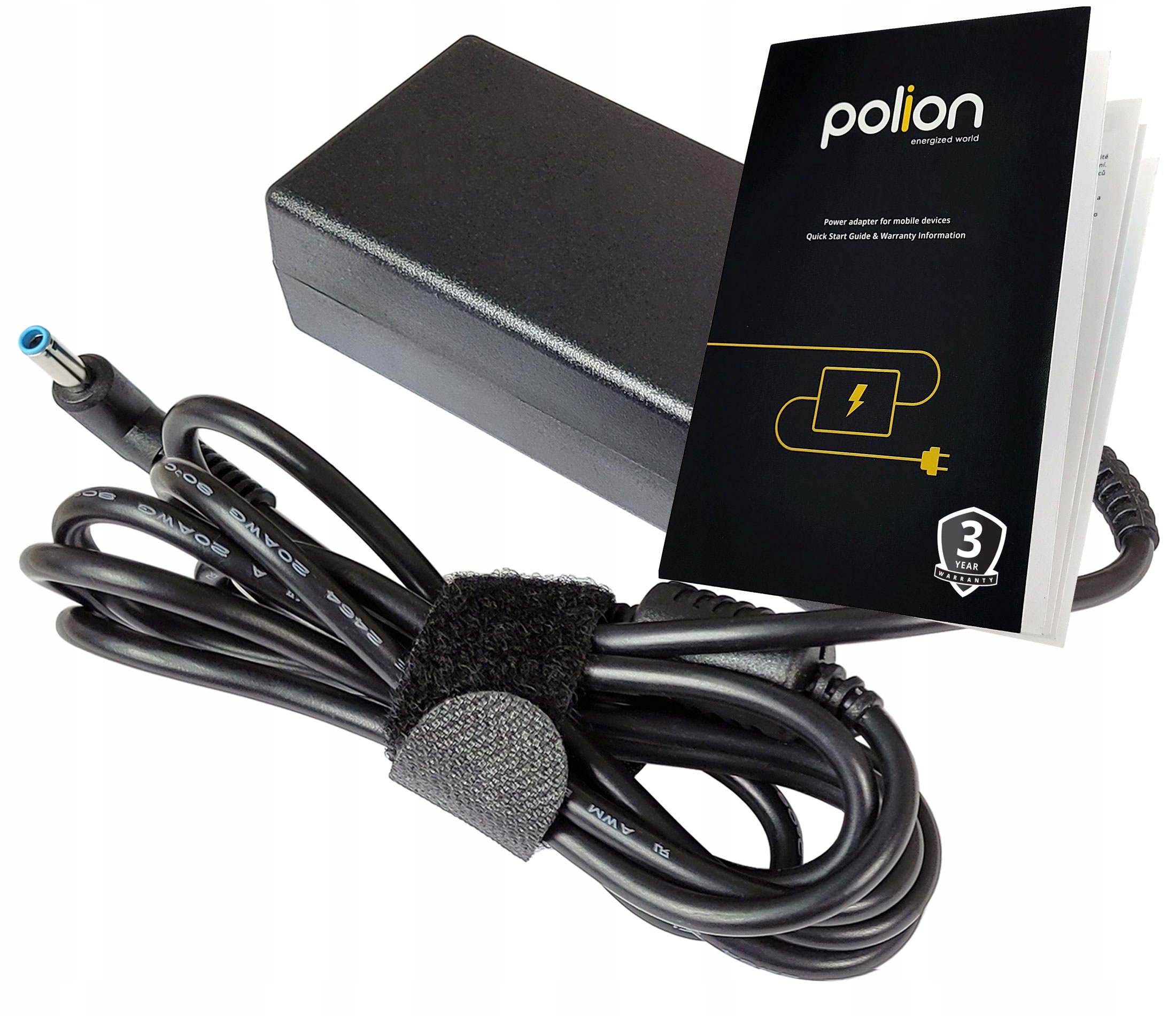 Czarny zasilacz do laptopa z kablem, broszurą i rzepem. Zasilacz jest prostokątny. Broszura jest czarna.