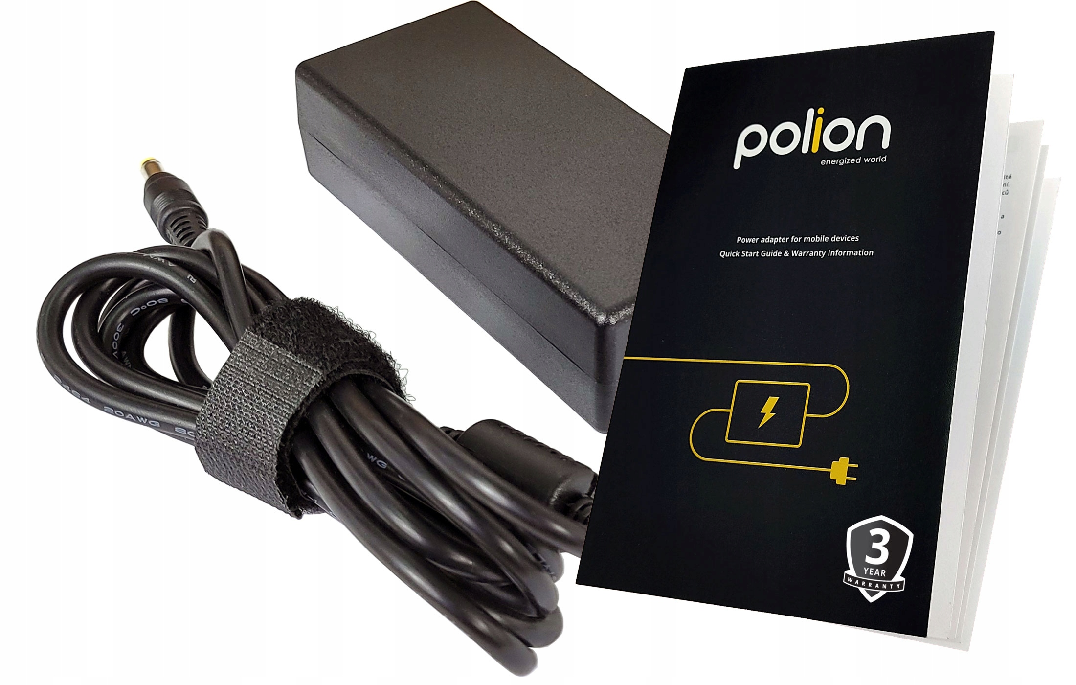 Czarny zasilacz, kabel i instrukcja na białej powierzchni. Zasilacz ma czarny kabel z rzepem.