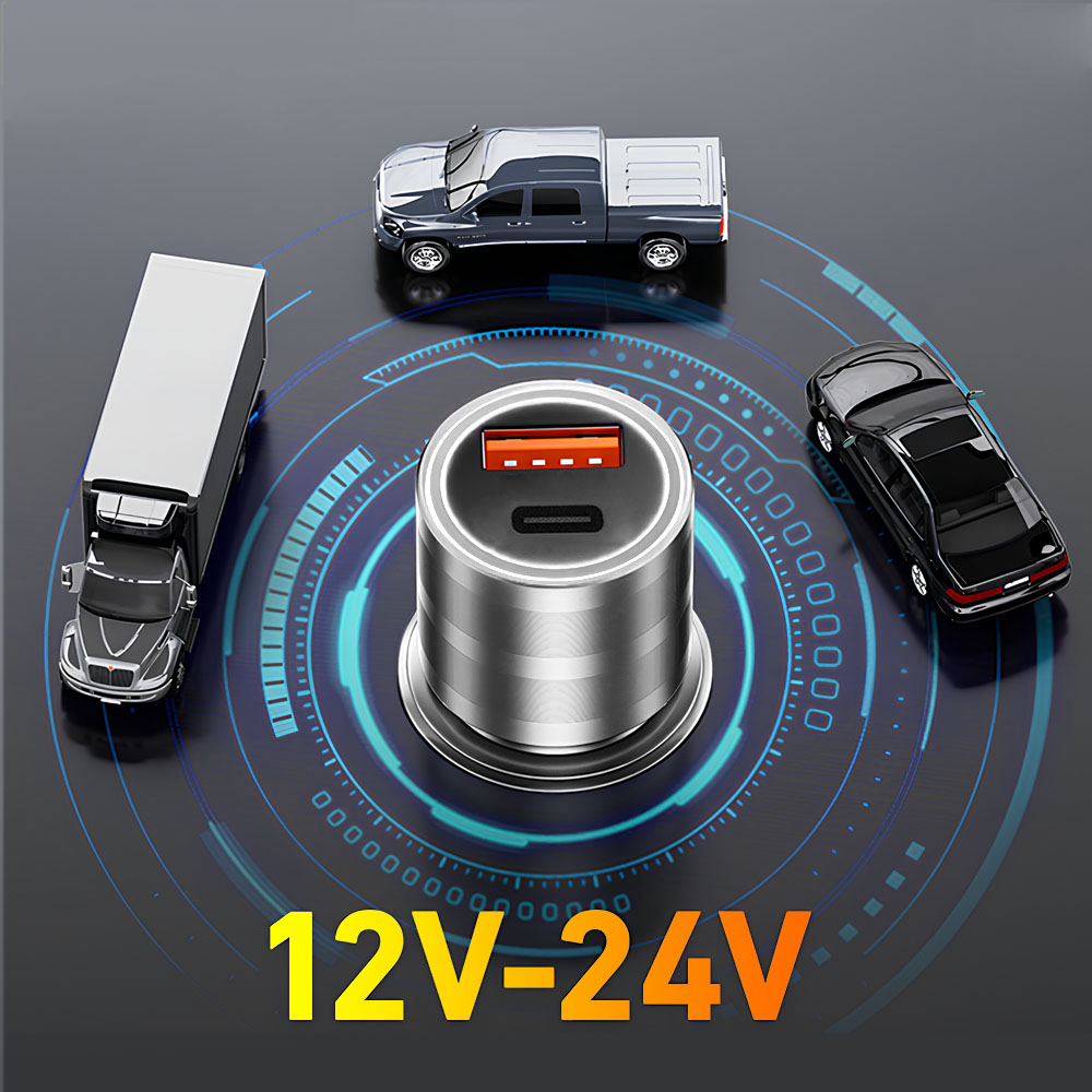 Ładowarka samochodowa z trzema zabawkami samochodami wokół. Ładowarka ma pomarańczowe i czarne detale oraz napis 12V-24V.