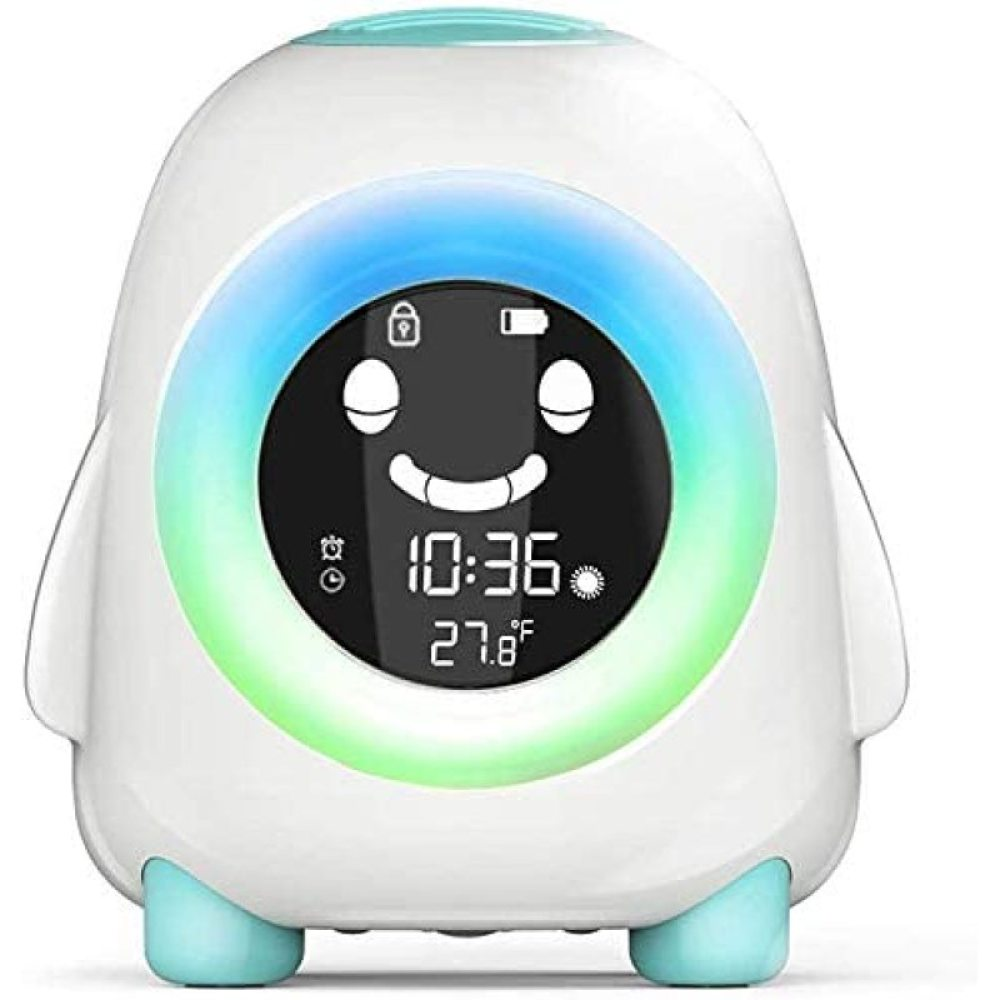 Ein weißer, pinguinförmiger Wecker zeigt die Uhrzeit 10:36 und 27,8°F an. Er hat ein lächelndes Gesicht auf dem Bildschirm und bunte Lichter.
