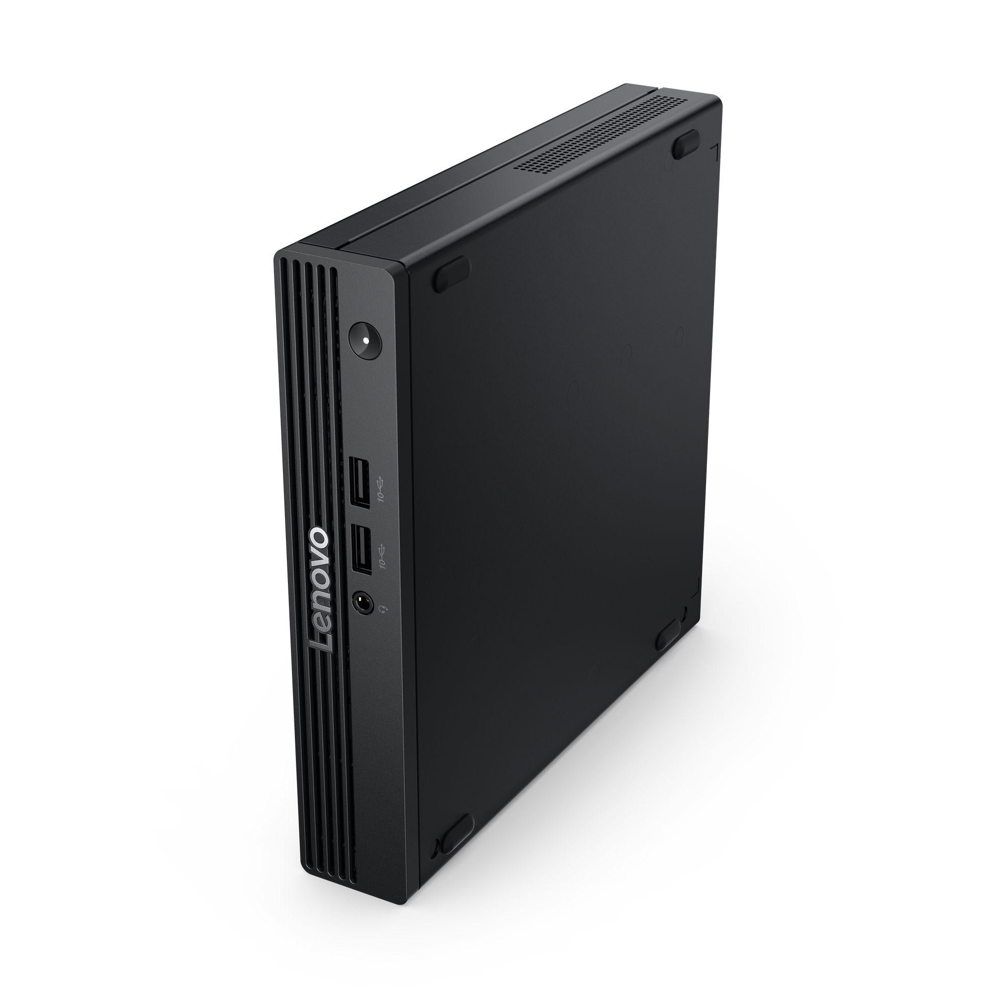 Czarny komputer stacjonarny Lenovo stoi na białej powierzchni. Posiada porty, wentylację i logo Lenovo.