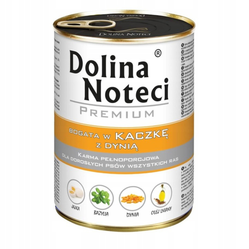 Puszka karmy dla psów z napisem 'Dolina Noteci'. Jest napisane 'Premium' i 'Bogata w kaczkę z dynią'. Ikony jaj, bazylii, dyni i oleju.