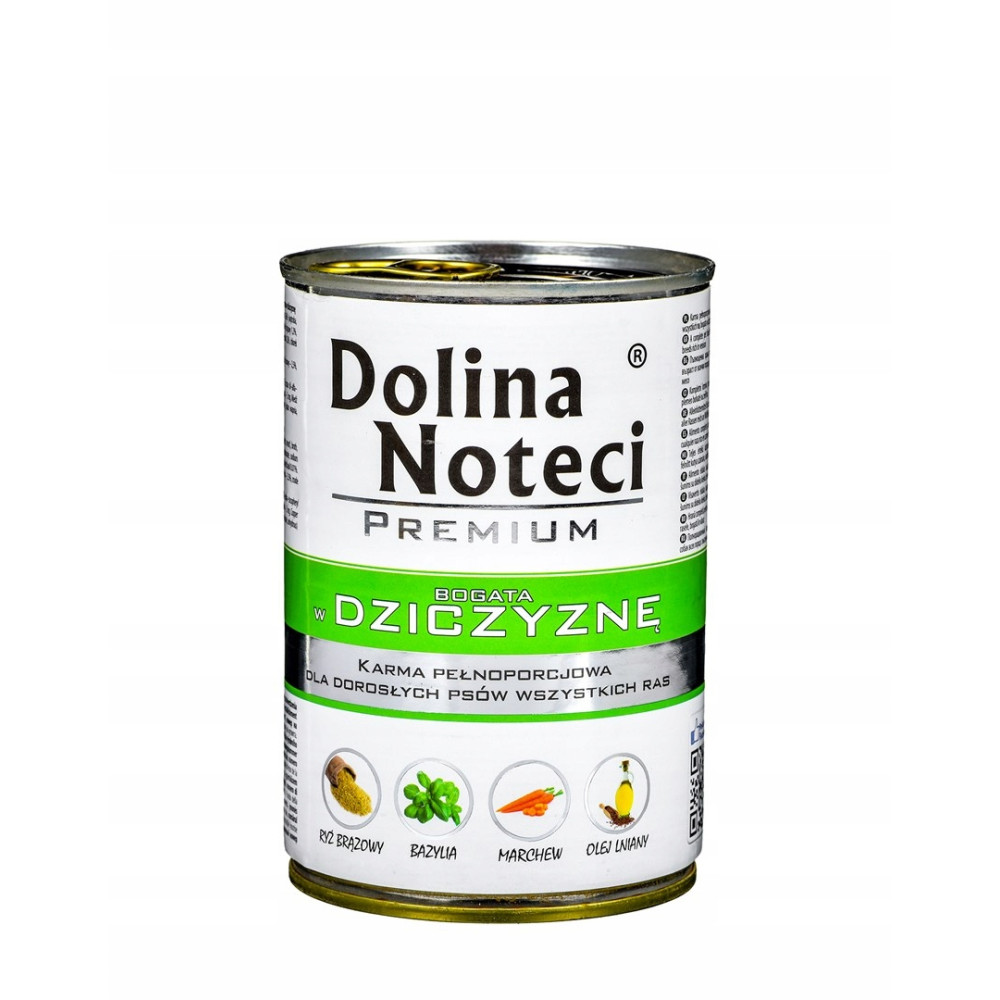 Una lata de comida para perros Dolina Noteci. Tiene texto e imágenes de ingredientes como arroz, albahaca, zanahorias y aceite.