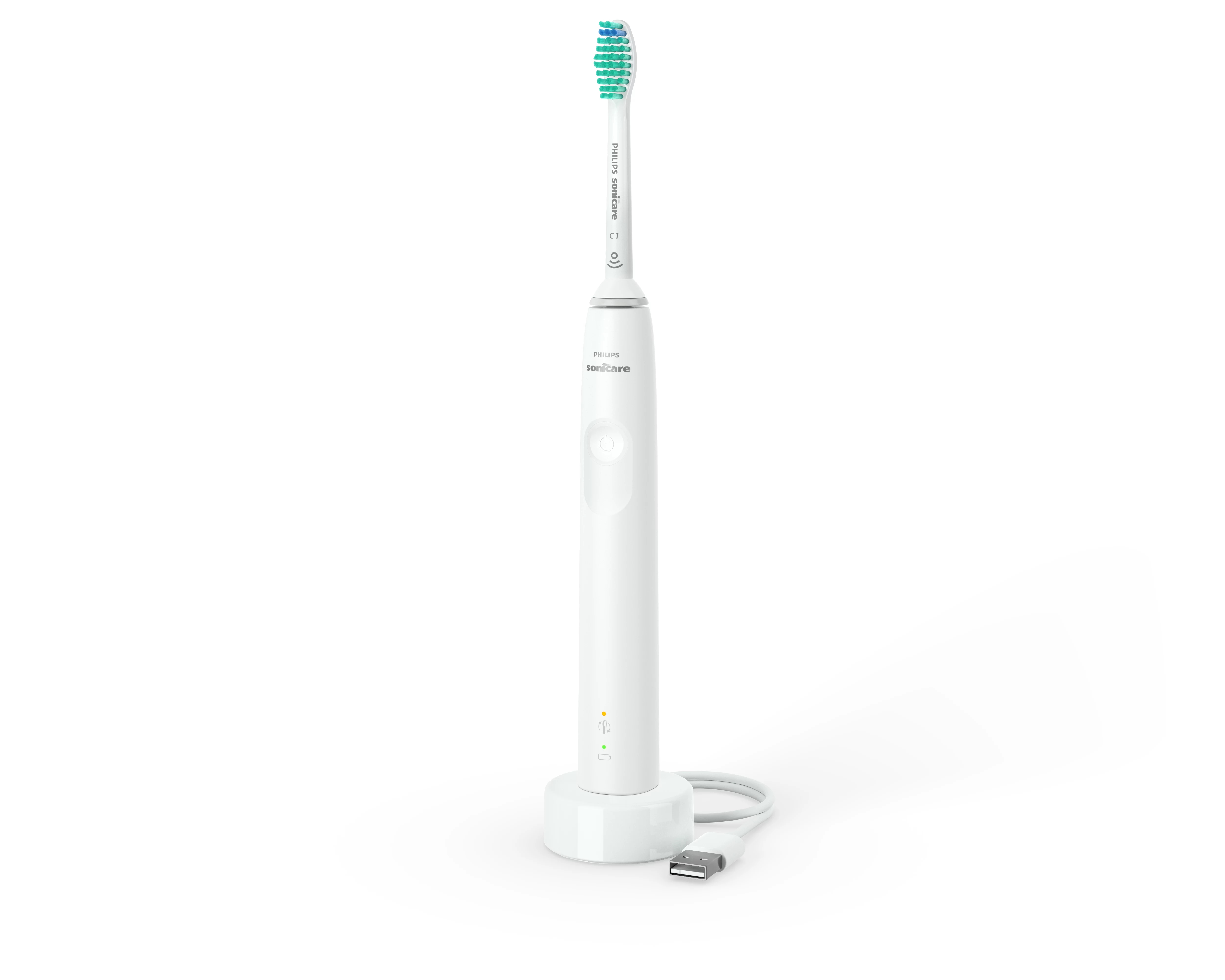 Biała elektryczna szczoteczka do zębów Philips Sonicare stoi na białej ładowarce z kablem USB. Szczoteczka ma zielone włosie.