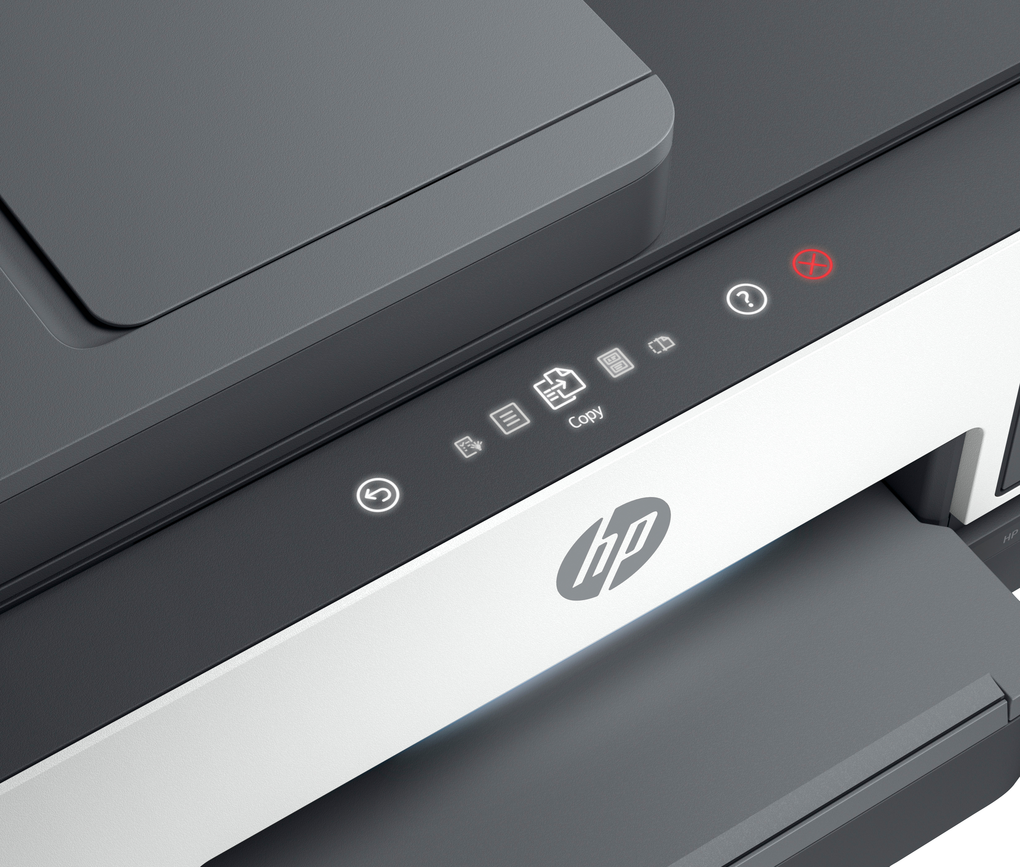 Close-up of a printer. Gray and white colors dominate. HP logo is visible. Several indicator lights and buttons are present.