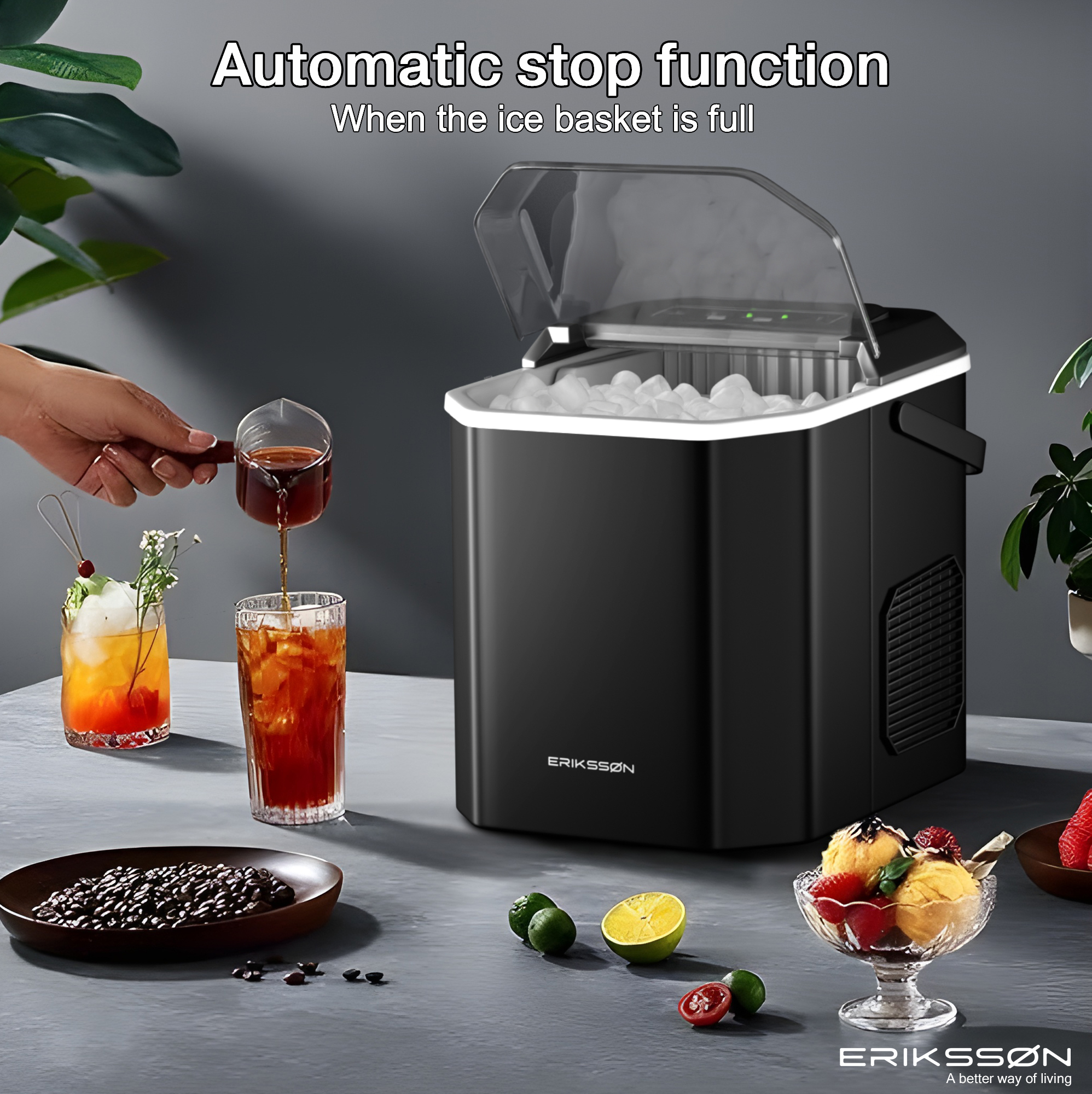 Black ice maker with open lid, pouring drink. Drinks, ice cream, coffee beans, and fruit on a table.