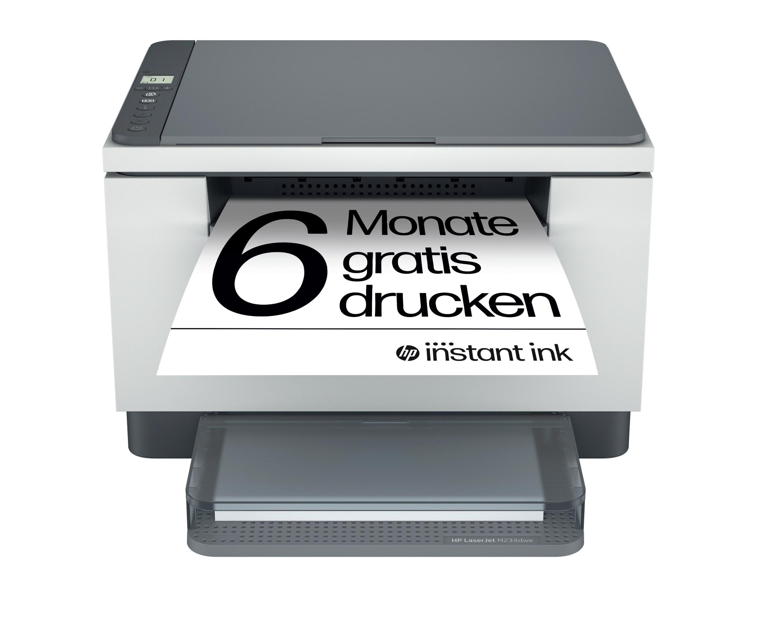 Ein weiß-grauer Drucker mit einem Papieraufdruck '6 Monate gratis drucken' und dem Instant Ink Logo.