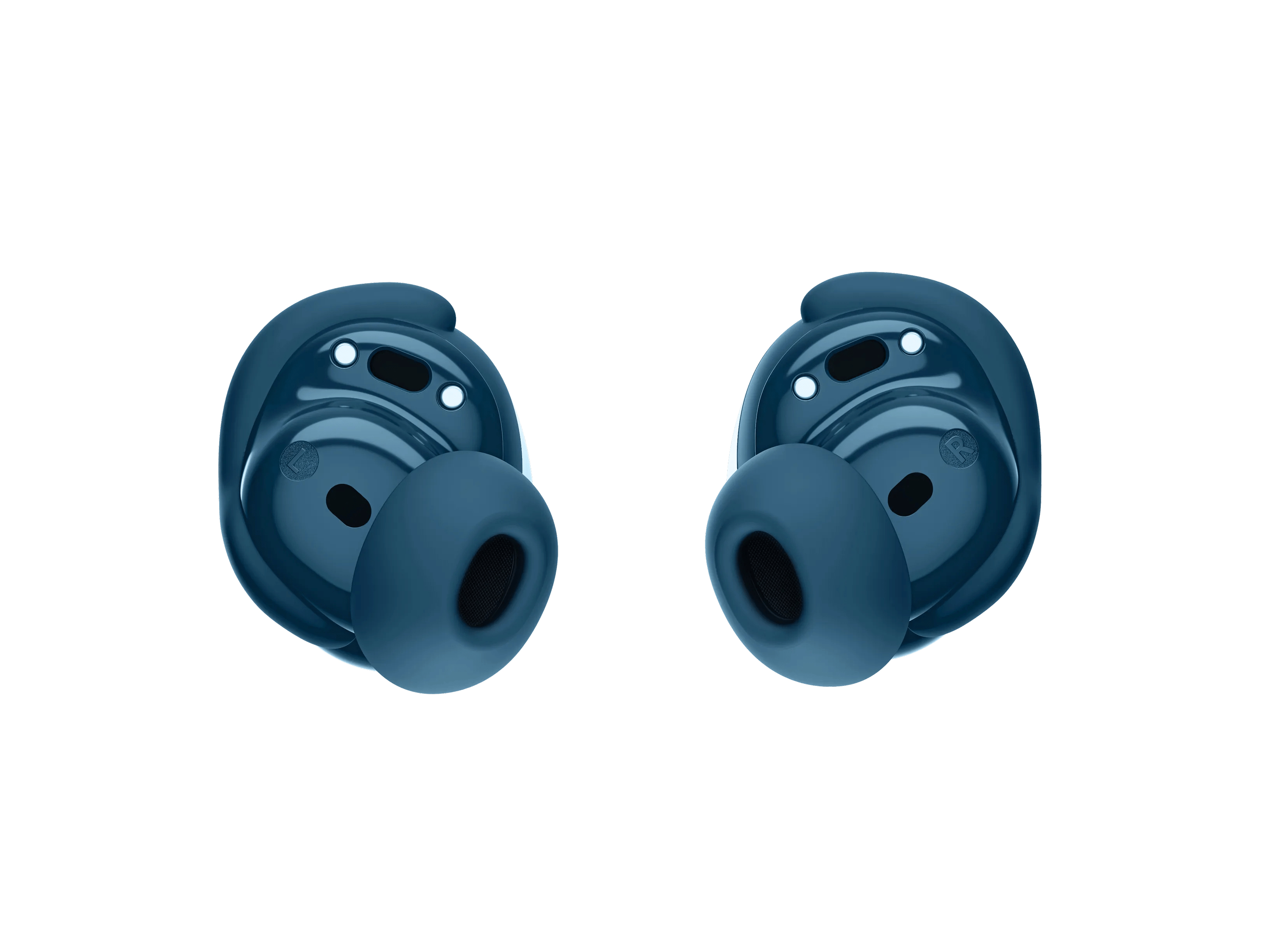 Dos auriculares inalámbricos azulados sobre un fondo blanco. Cada uno tiene un cuerpo redondeado y una punta suave para el oído.