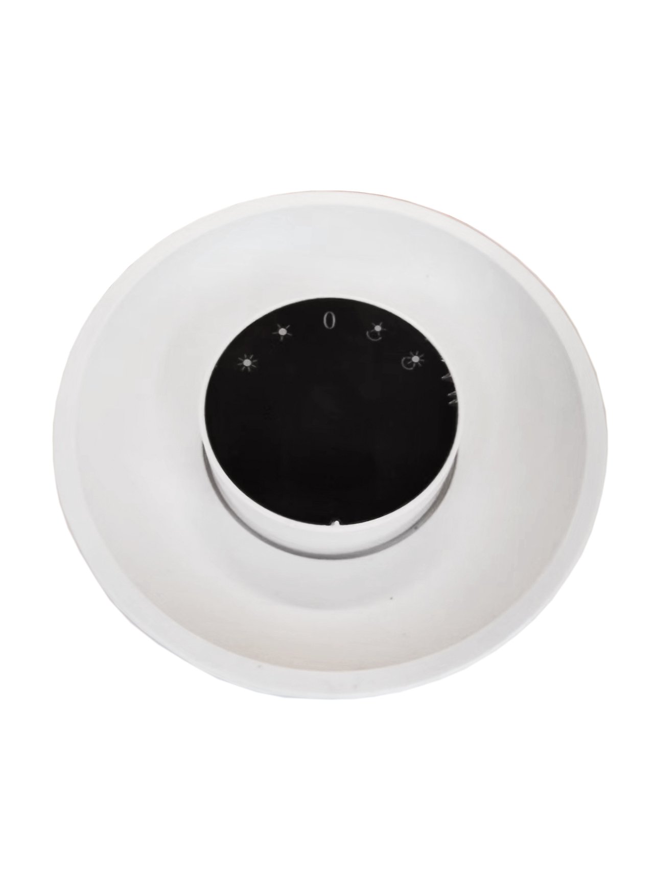 Un dispositivo circular blanco con un dial central negro. El dial presenta un cero y símbolos solares. El dispositivo está sobre un fondo blanco.