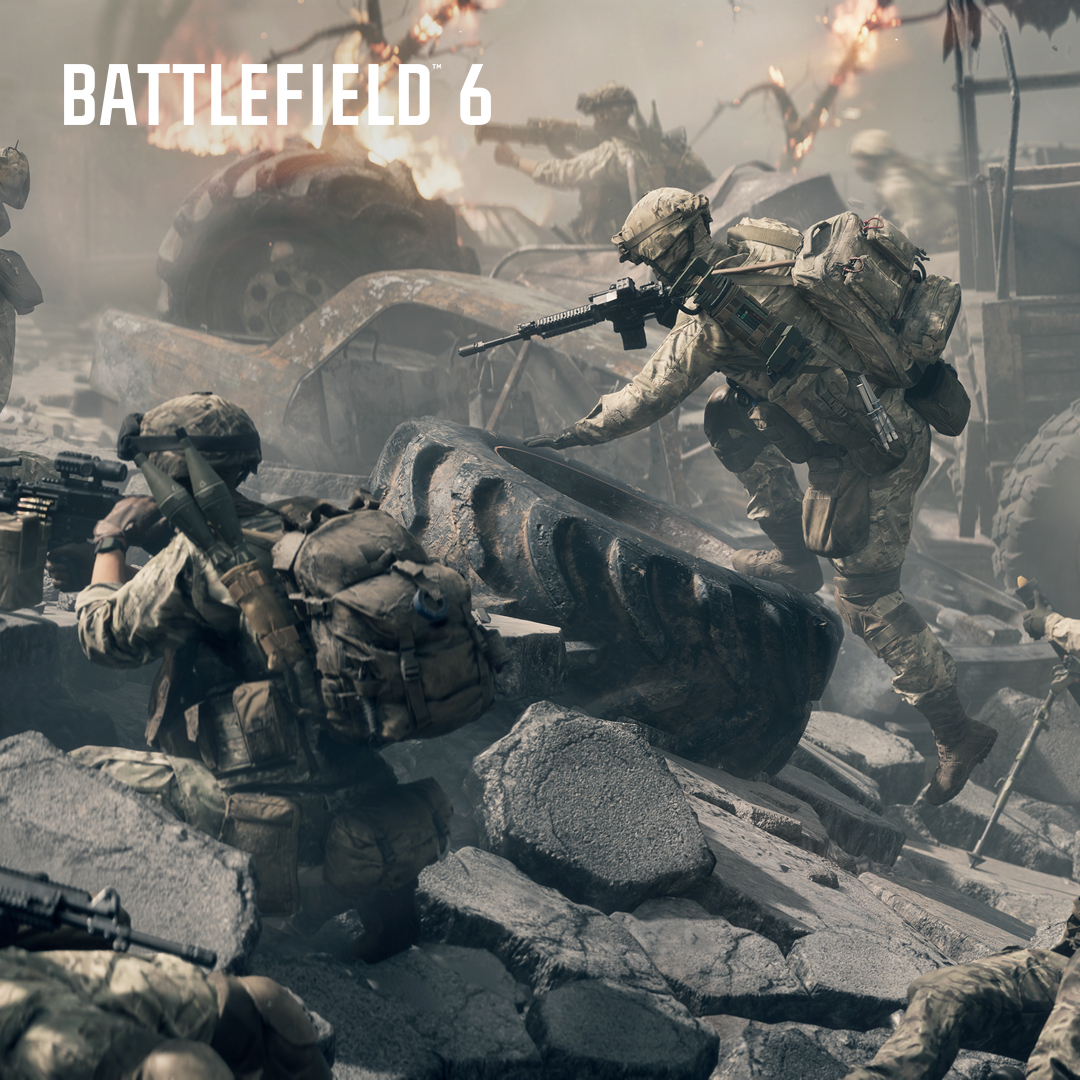 Żołnierze w mundurach bojowych poruszają się po gruzach, eksplozje w tle. Żołnierz wspina się na oponę. Logo Battlefield 6 u góry.