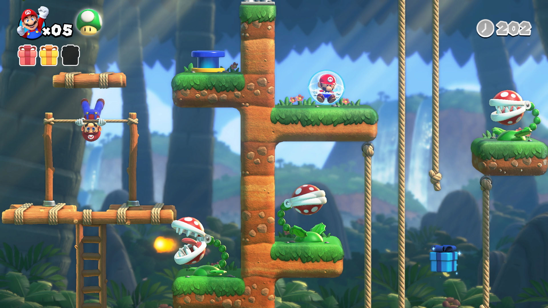 Mario en una burbuja, colgado boca abajo, plantas Piraña y un hongo verde en un entorno selvático.